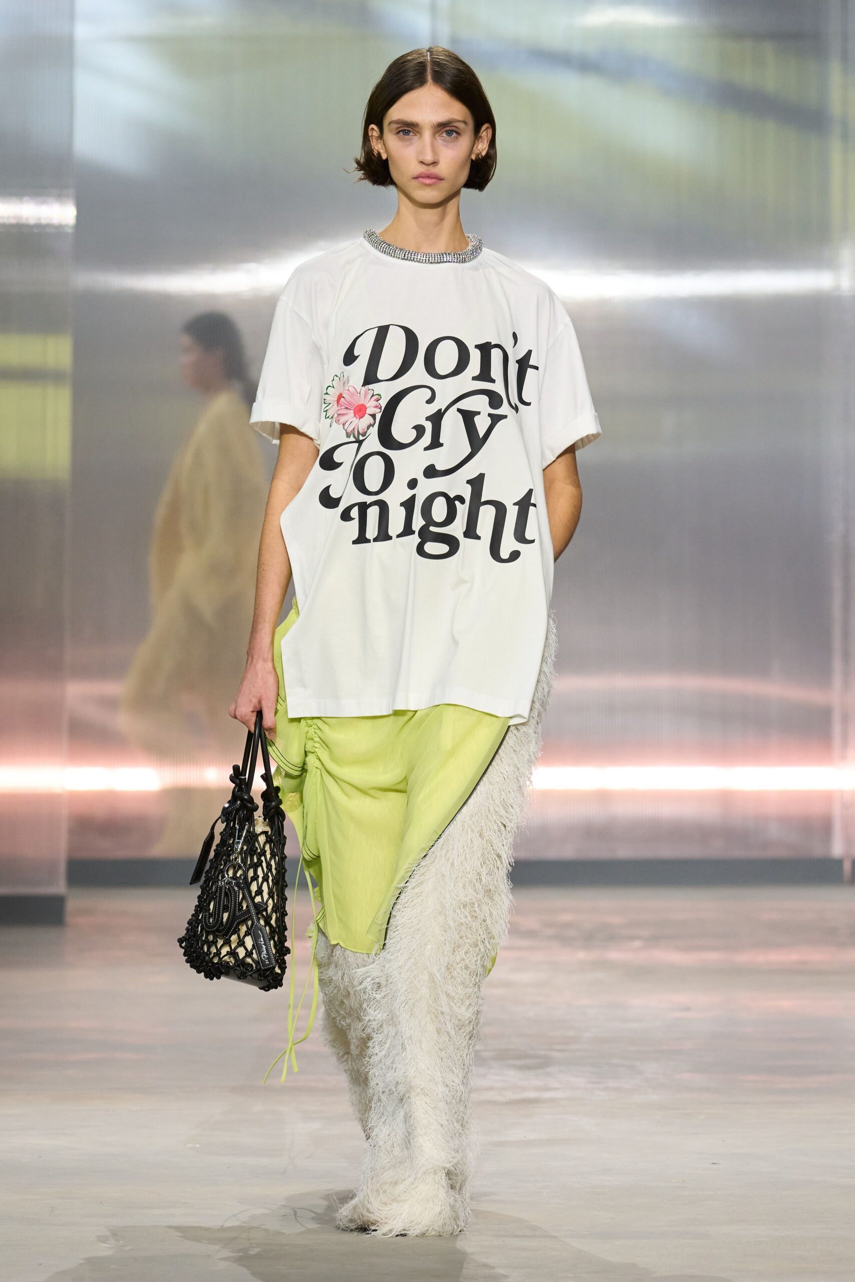 white printed t-shirt with green pants