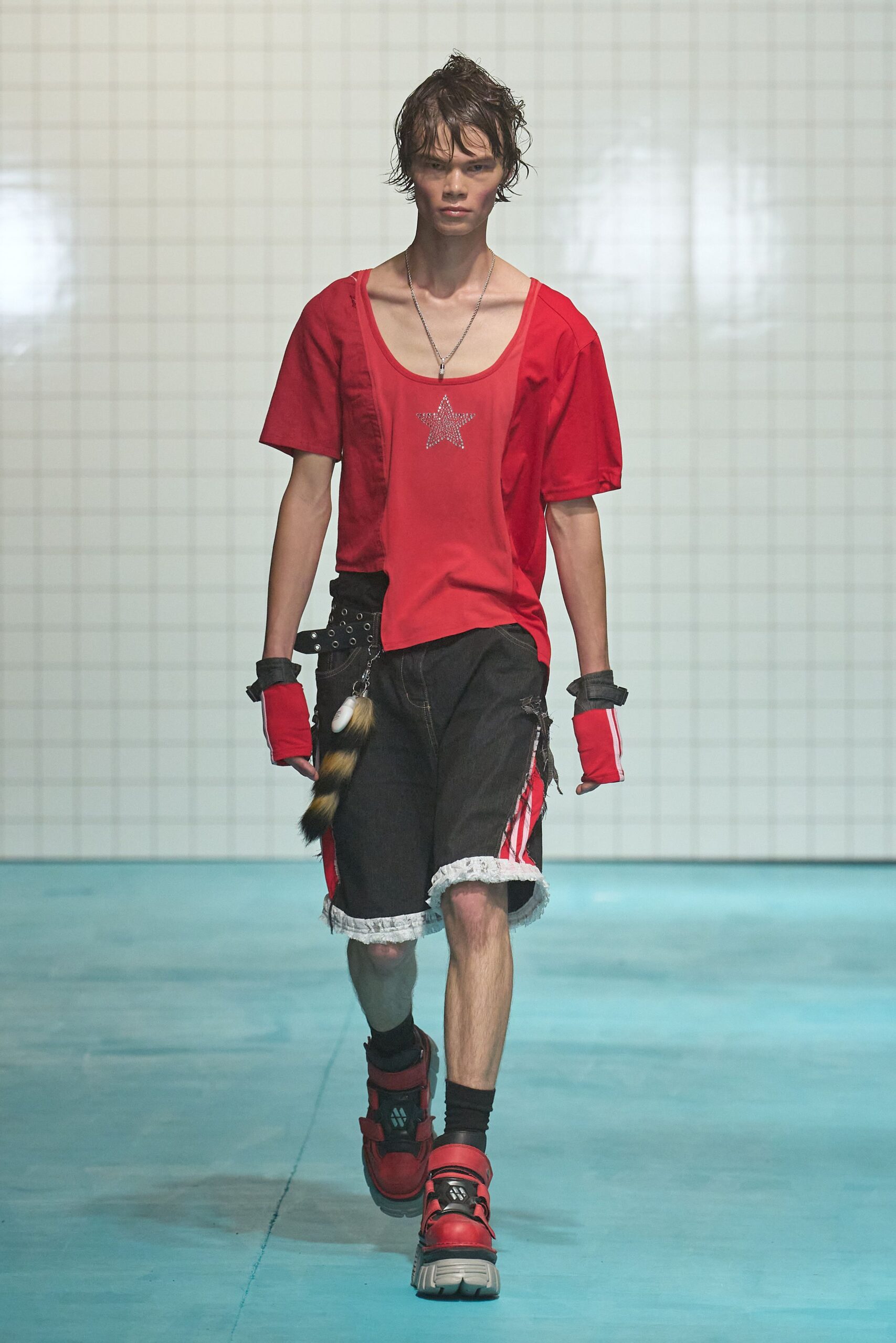 red relaxed top with black shorts