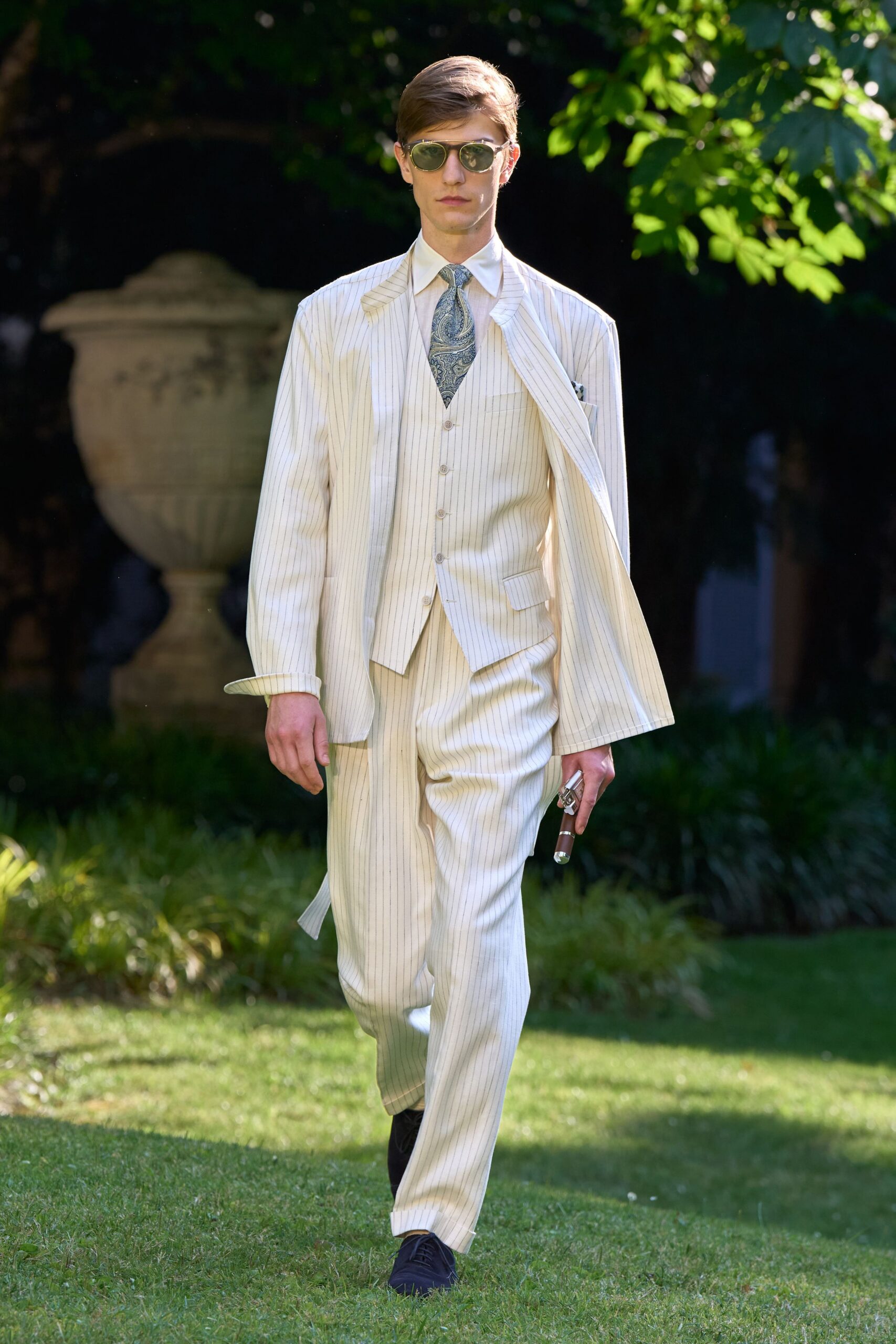 beige tailored suit with sunglasses