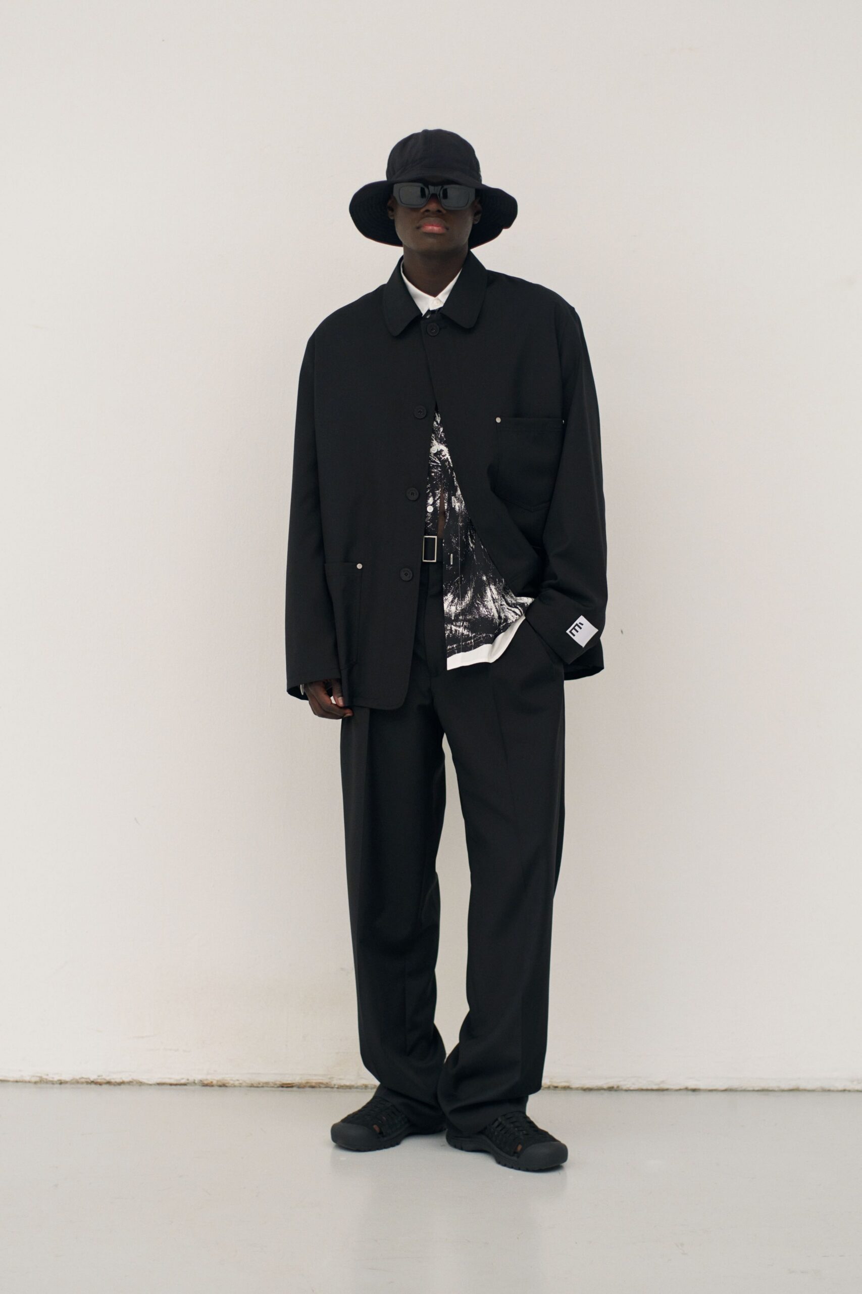 black relaxed jacket with shirt and pants