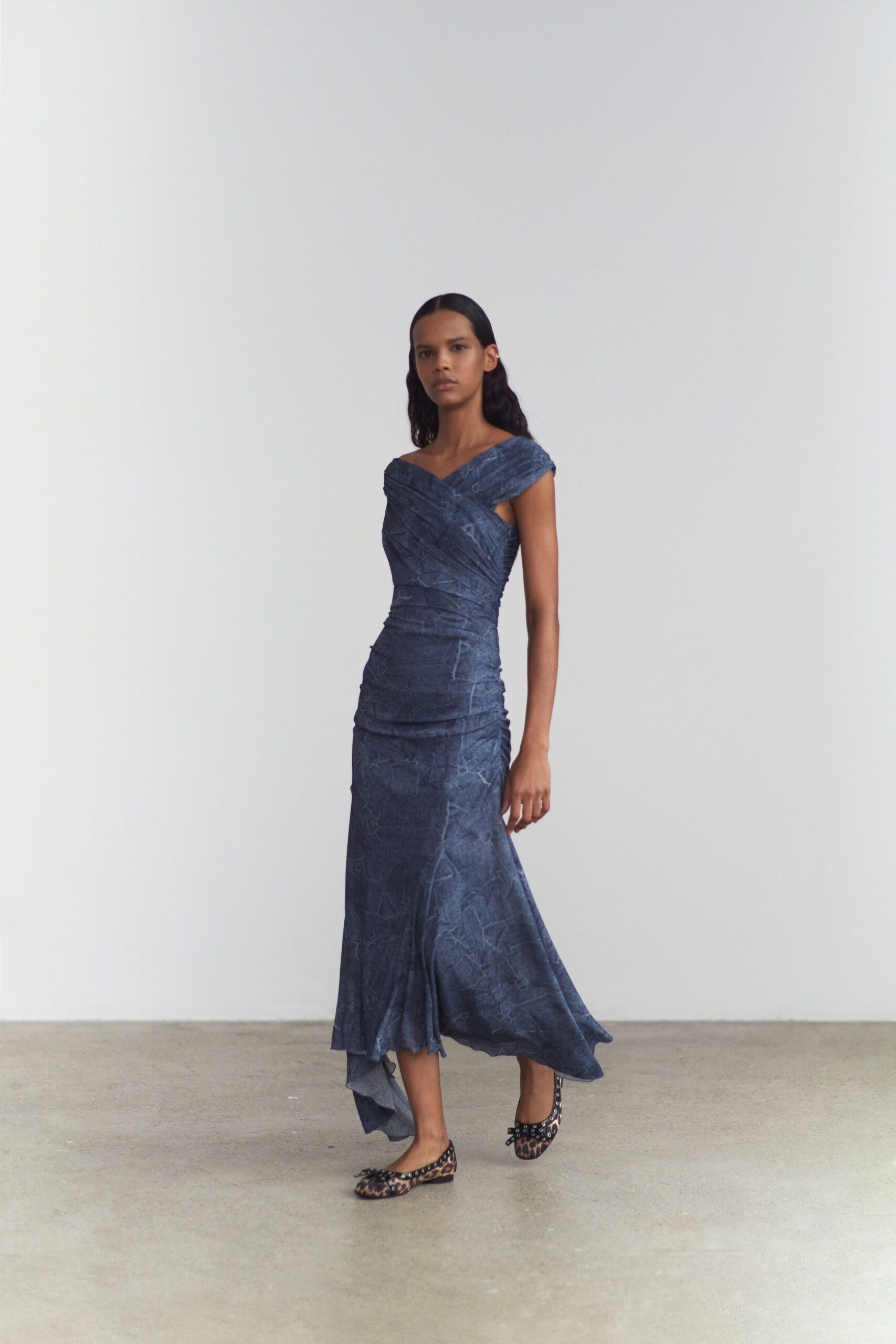 blue silk fitted gown with animal-print shoes