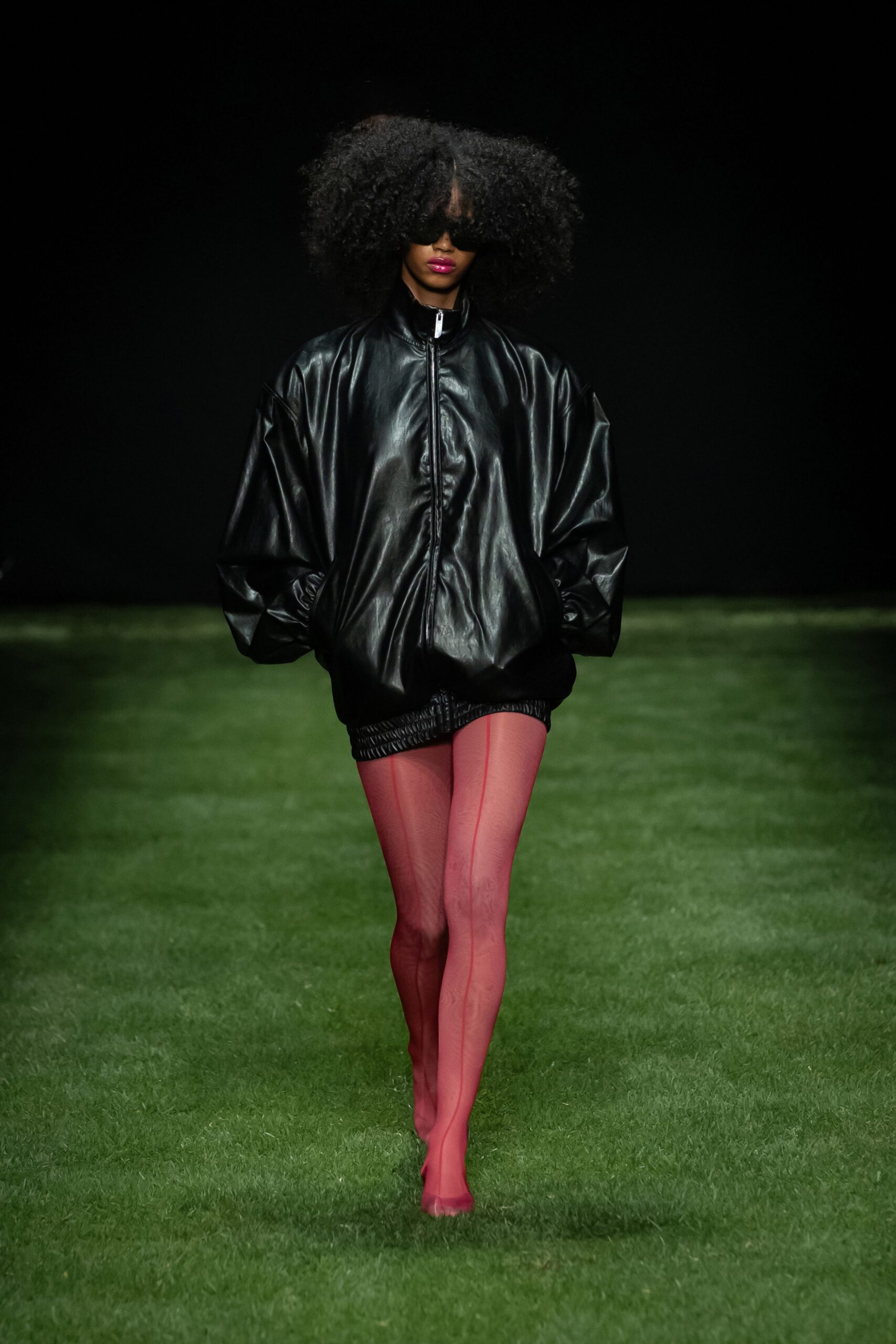 black leather oversized jacket with pink shorts