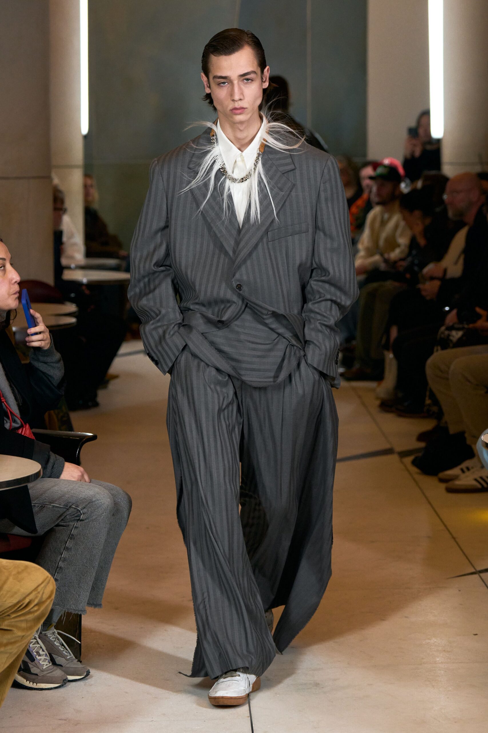 gray striped relaxed suit with white shoes