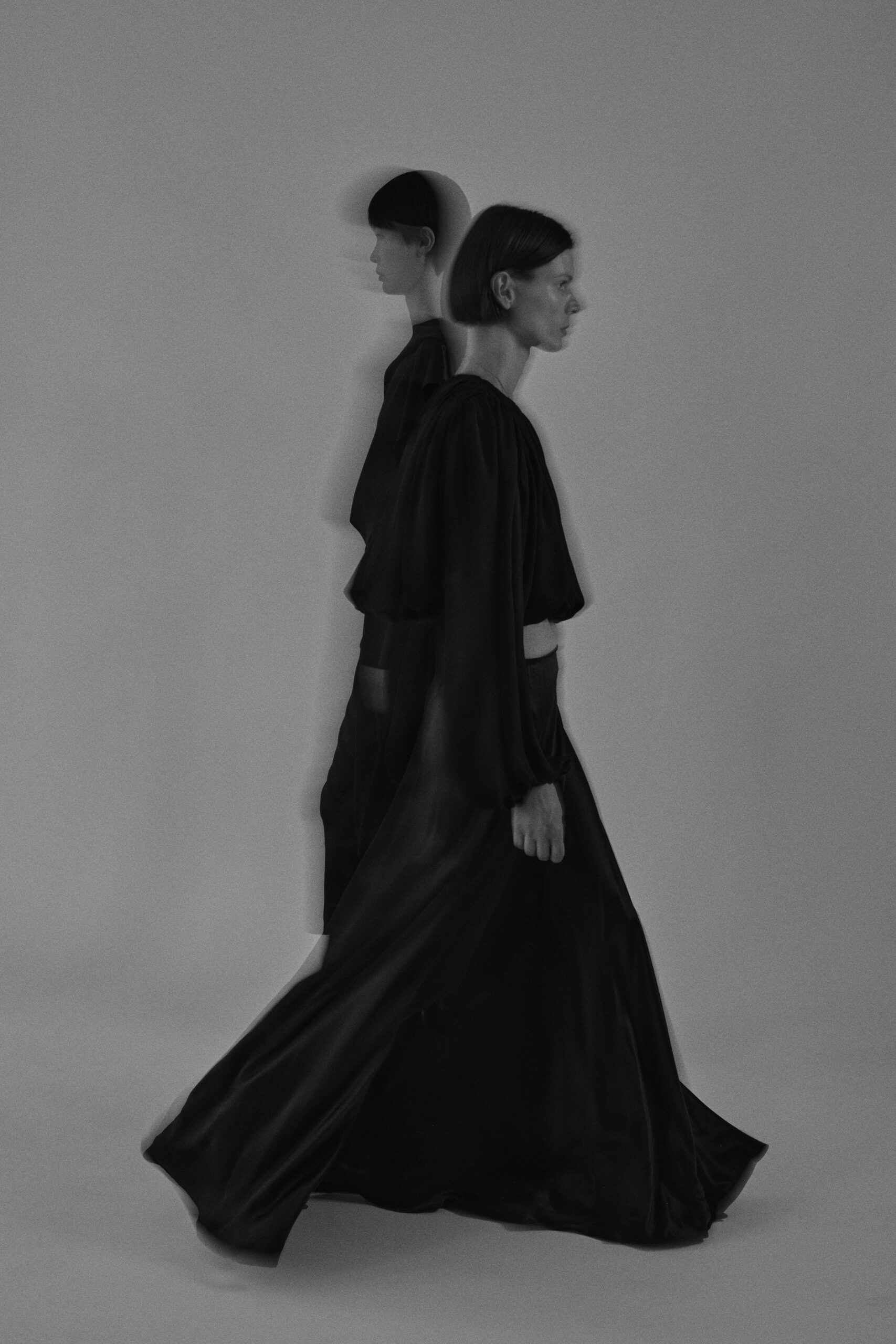 black silk long-sleeve fitted draped flowing cropped top