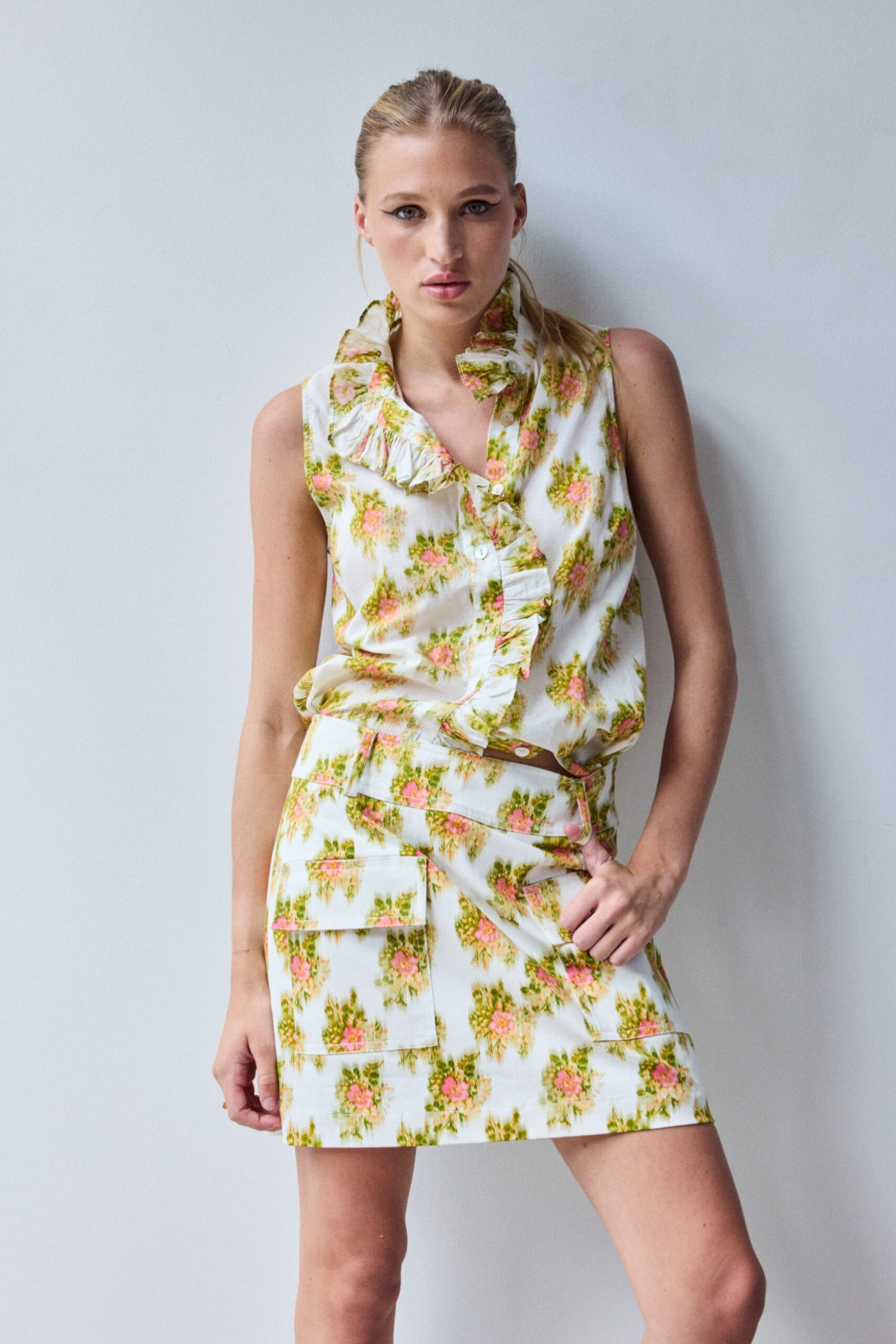 white cotton sleeveless collared fitted floral ruffled top