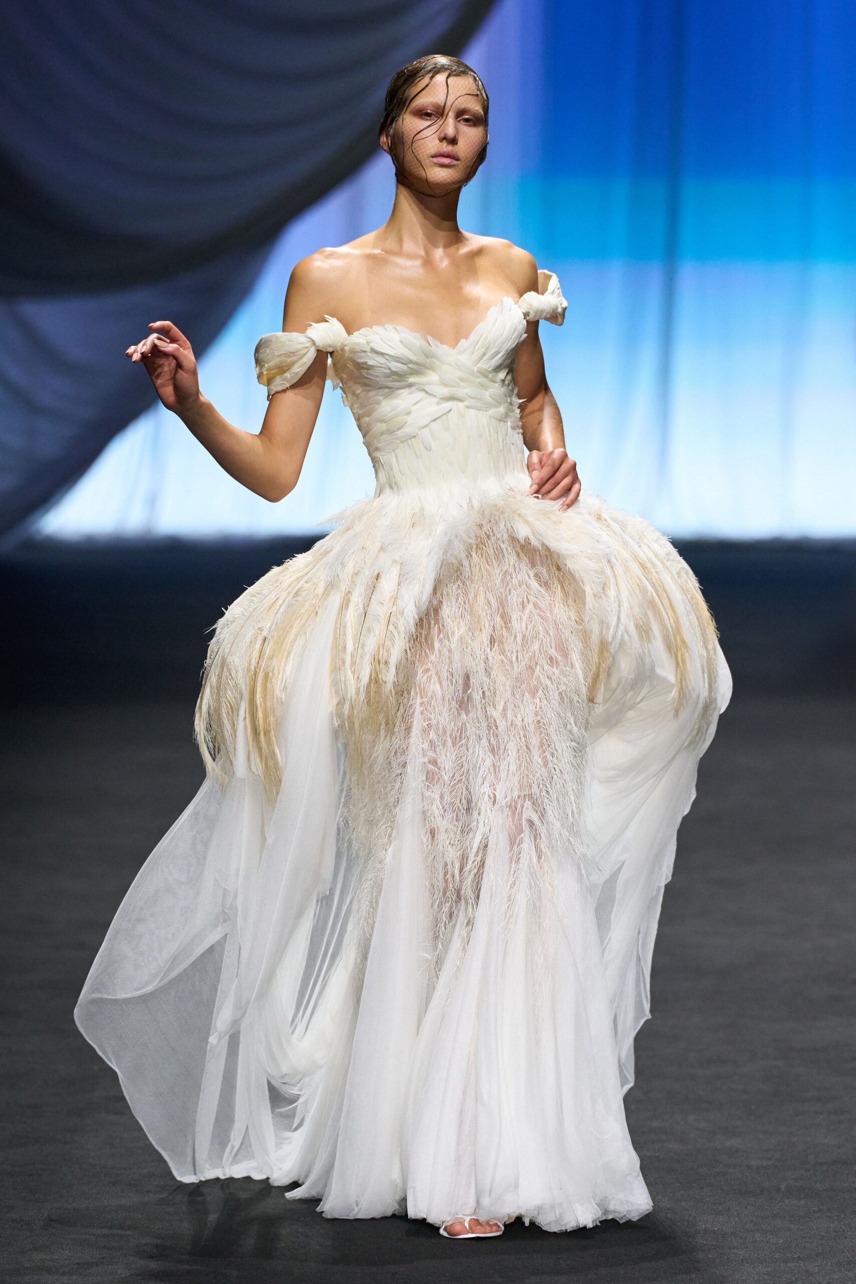 white off-shoulder flowing gown
