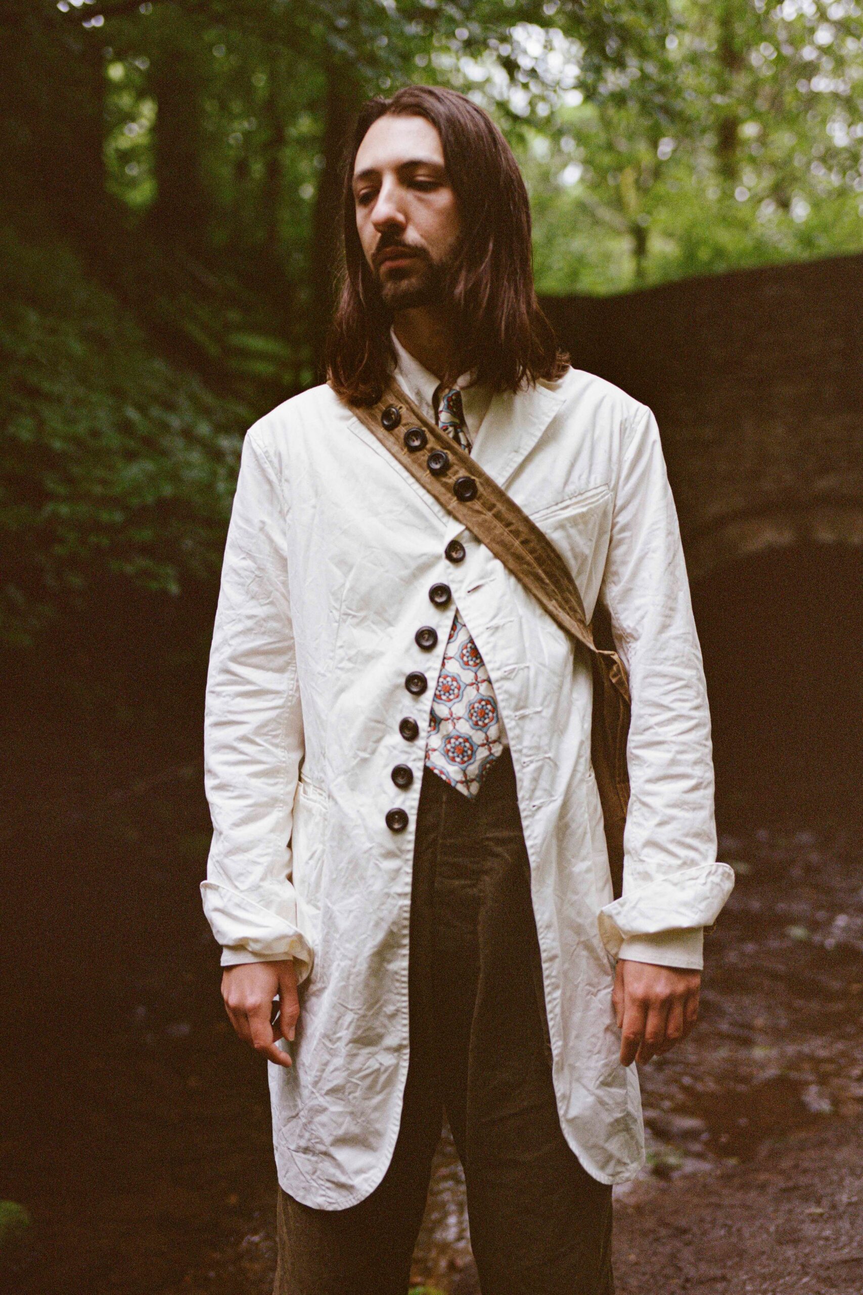 white cotton long-sleeve collared relaxed buttoned coat