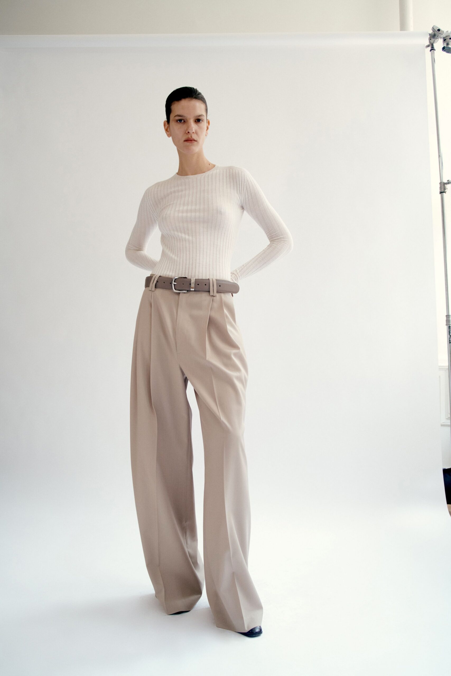 white fitted top beige wide-leg pants