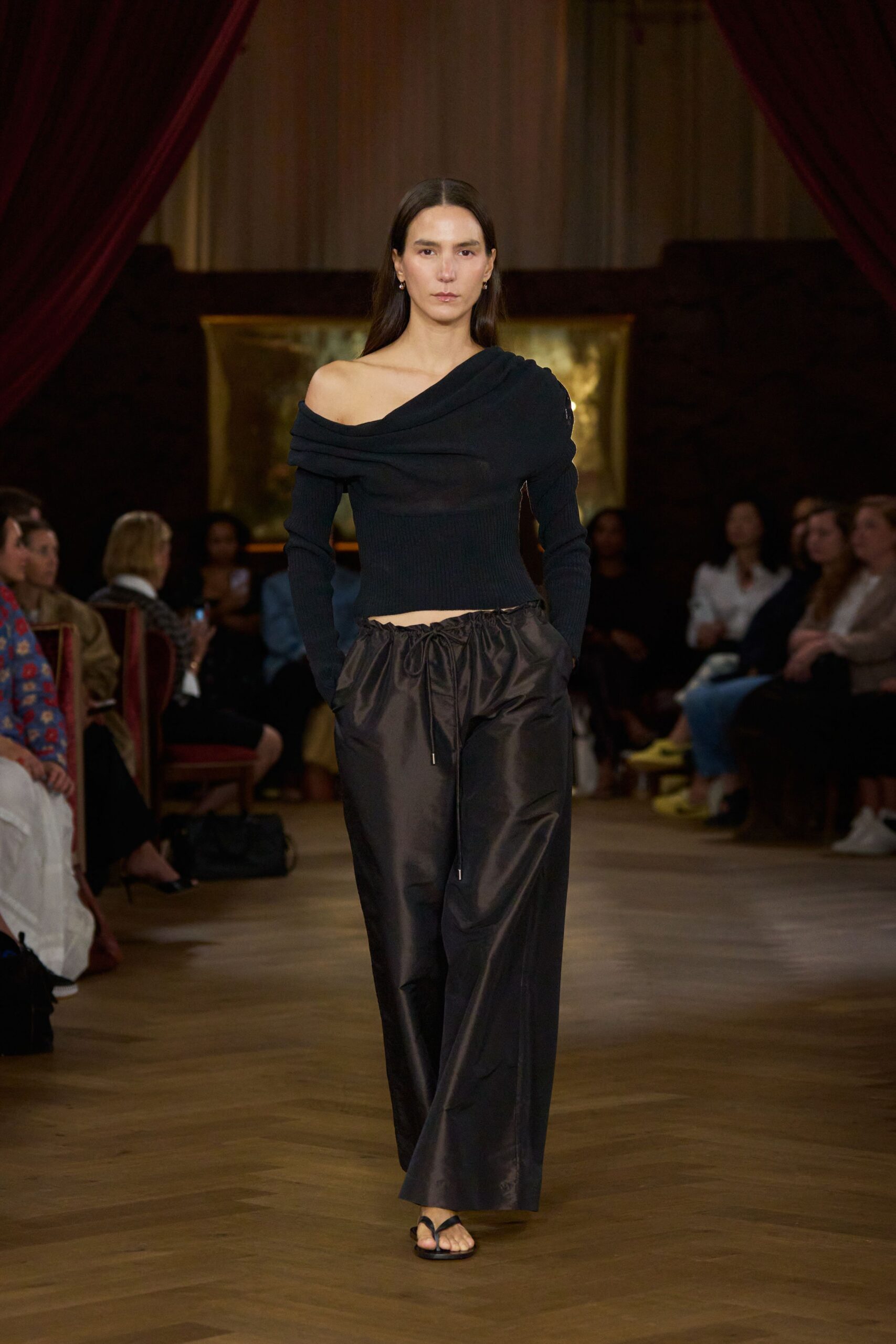 black off-shoulder top with relaxed pants