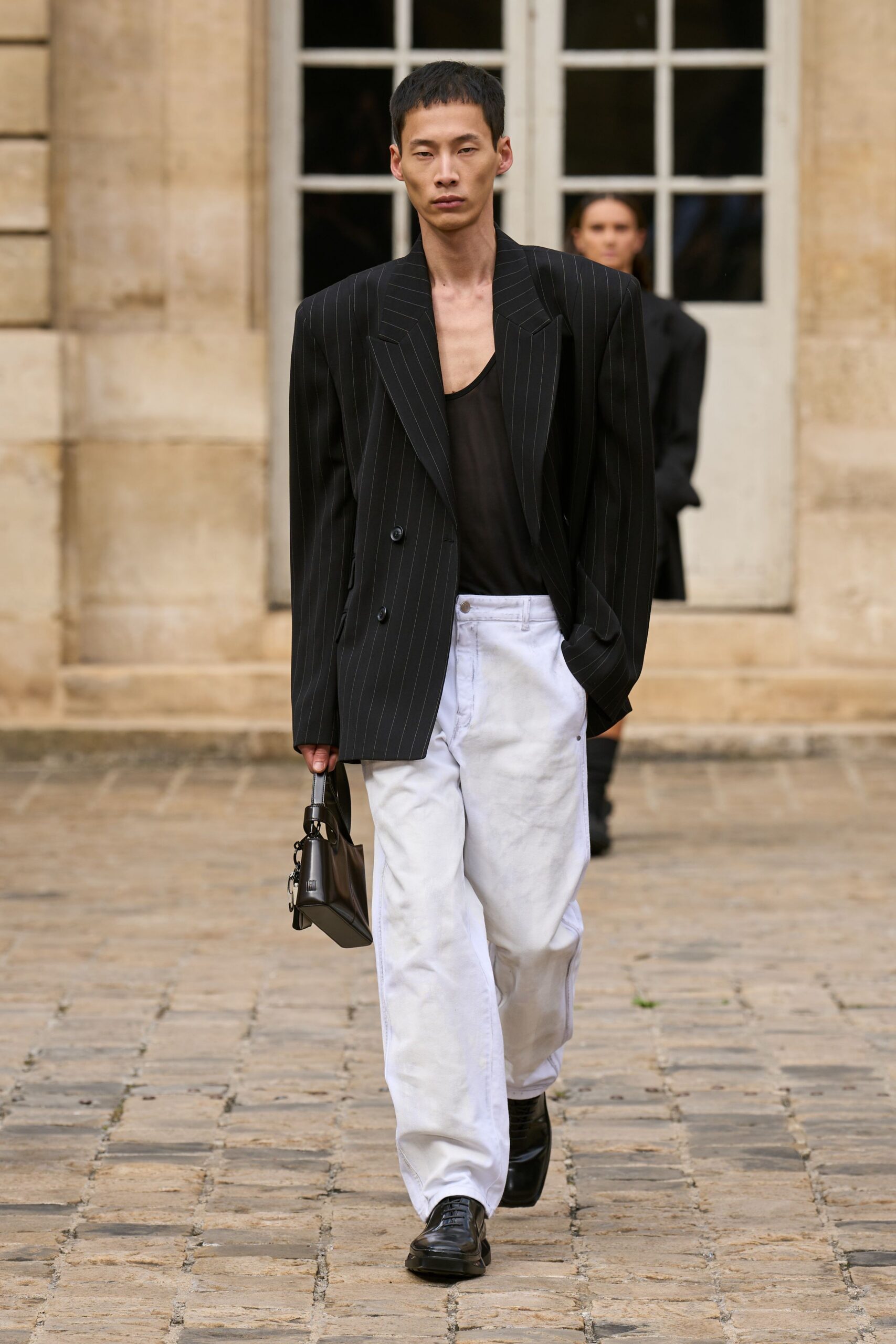 black tailored blazer with white pants