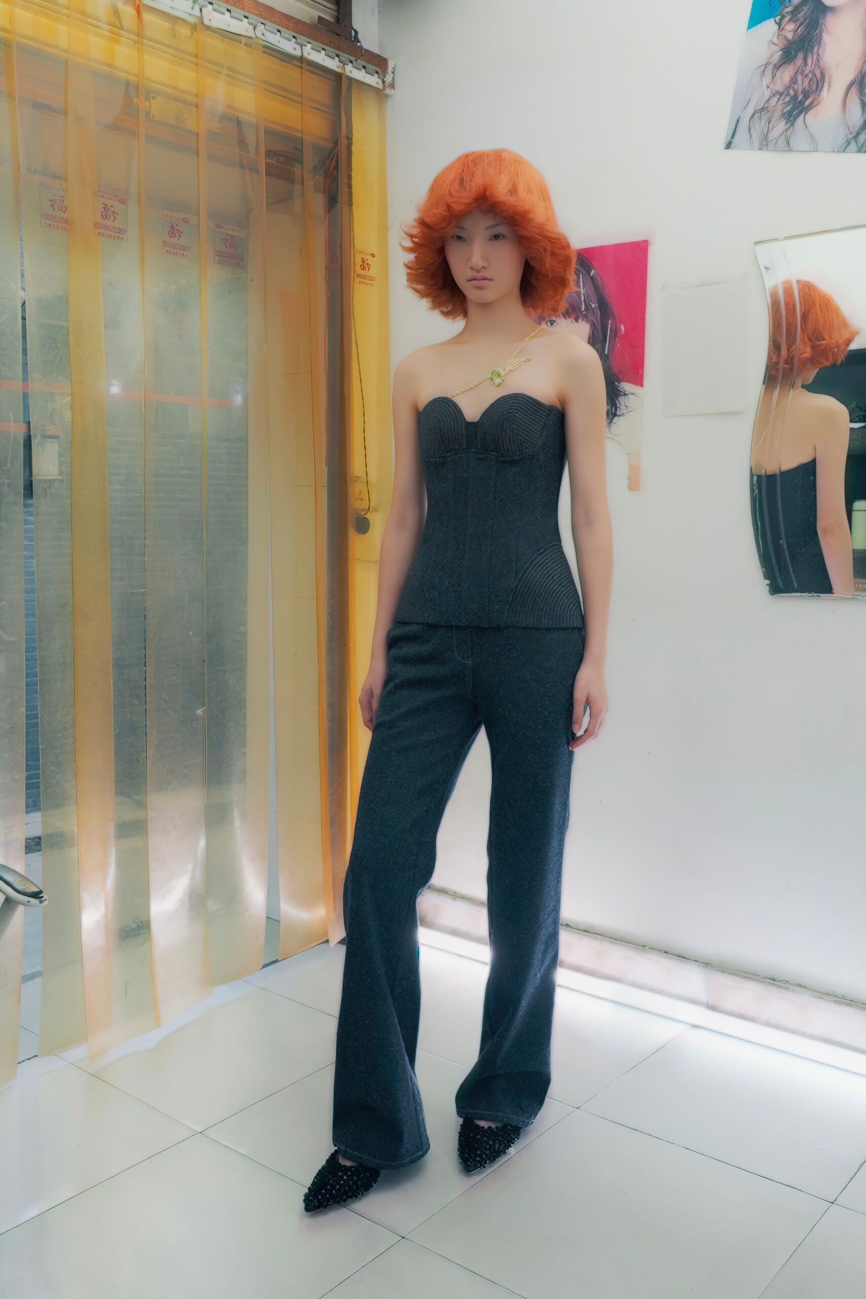black bustier with gray flared pants