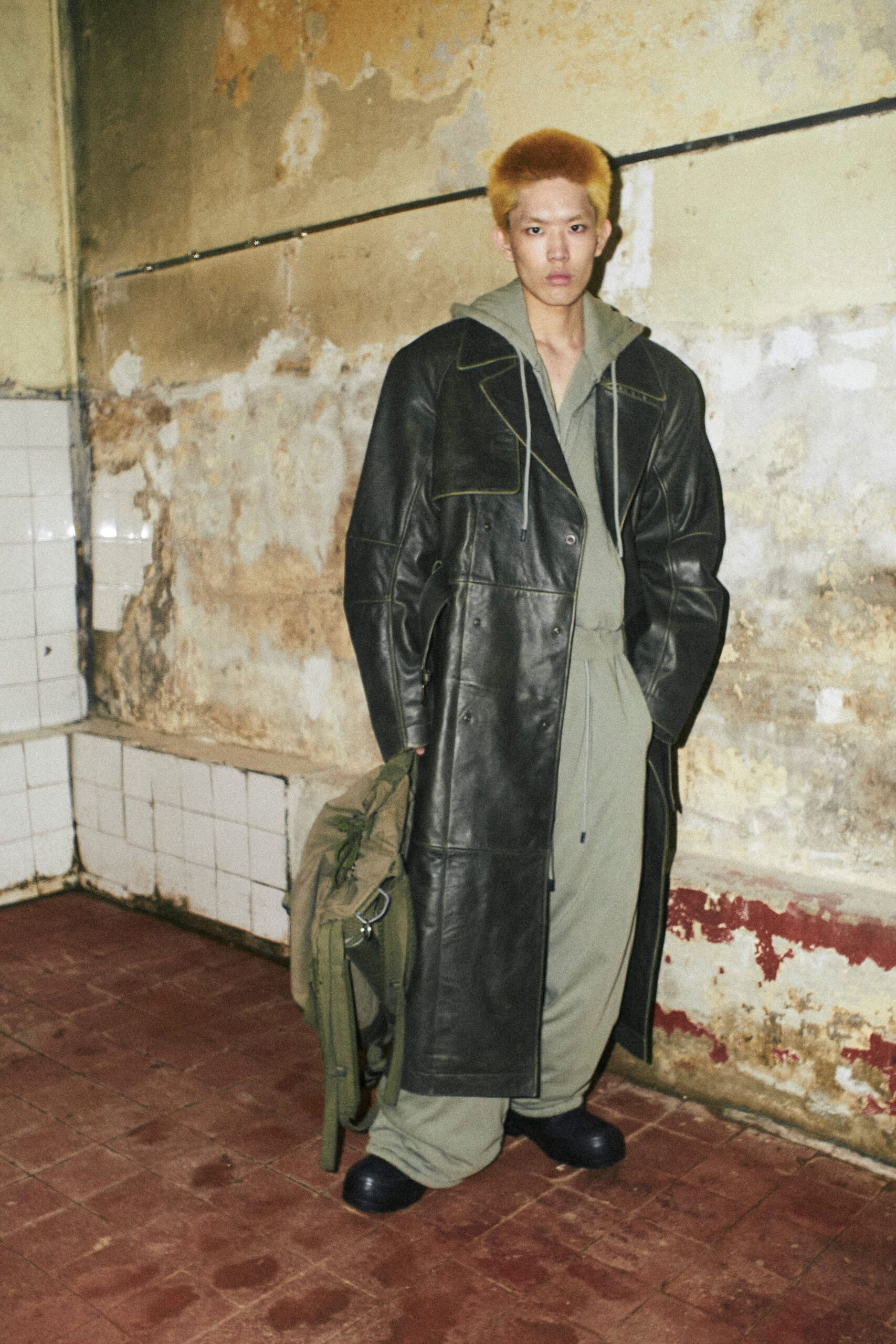 black leather coat green jumpsuit