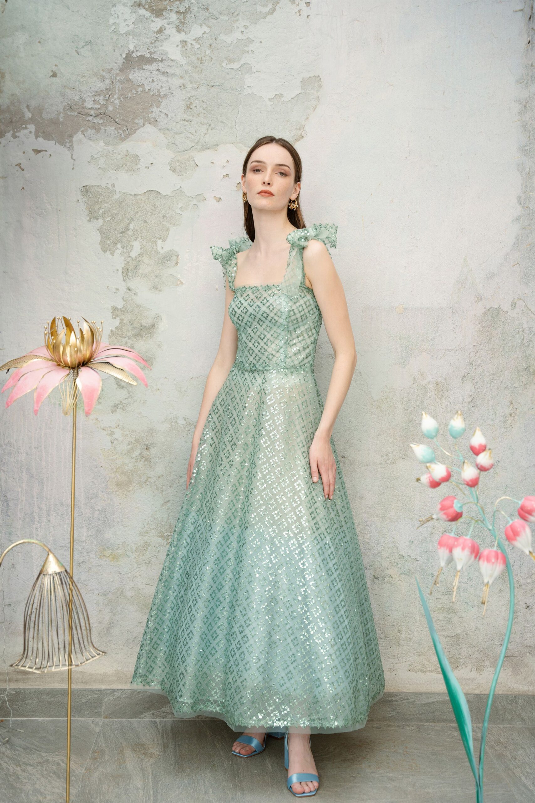 green silk sleeveless square-neck fitted pleated embellished gown