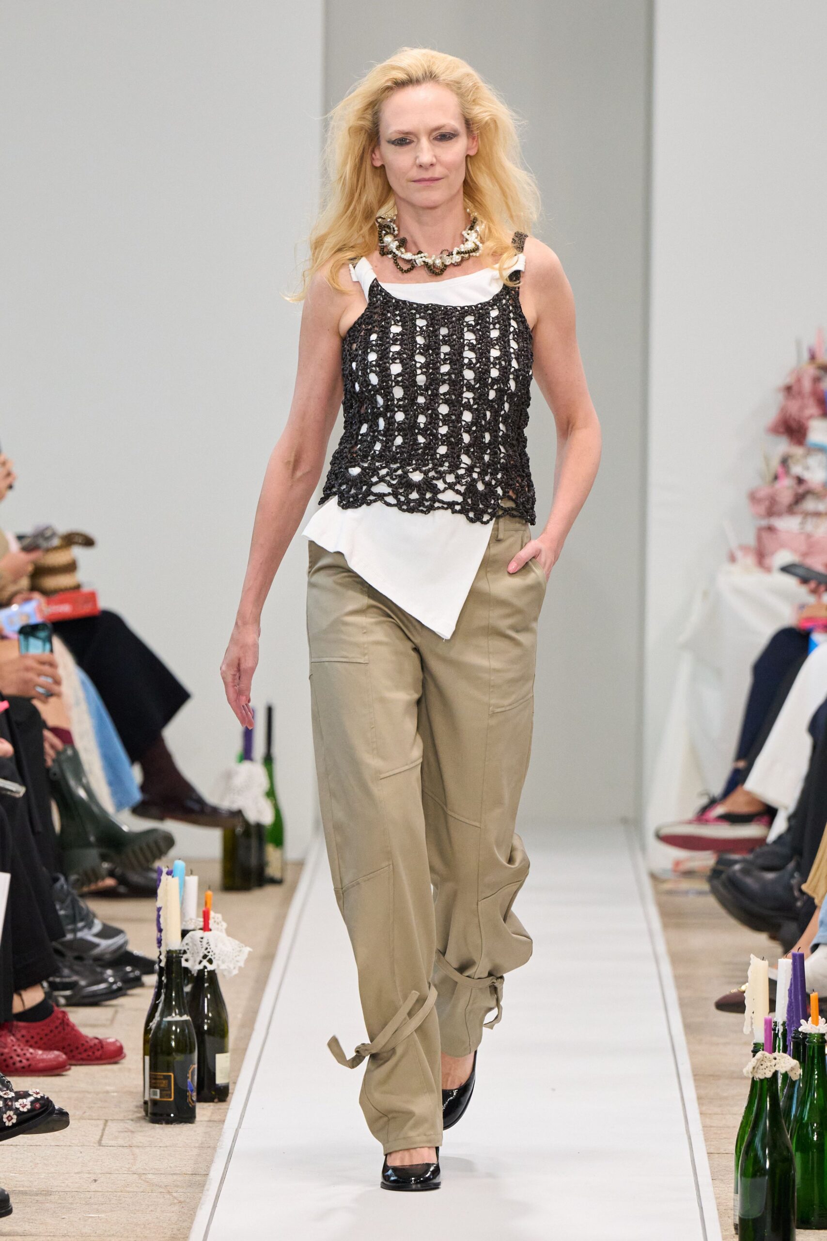 black crochet top beige pants