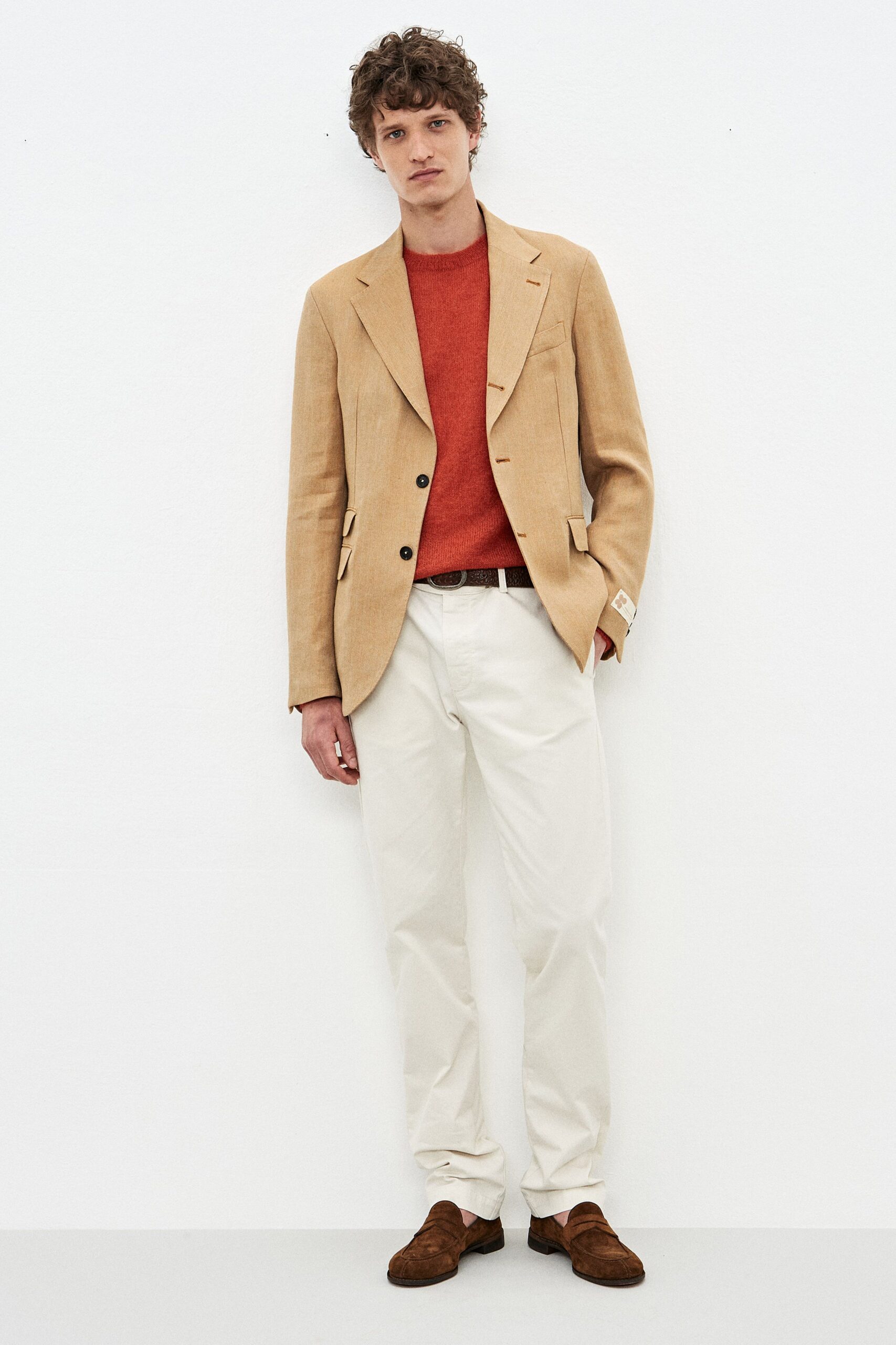 beige blazer red sweater white pants