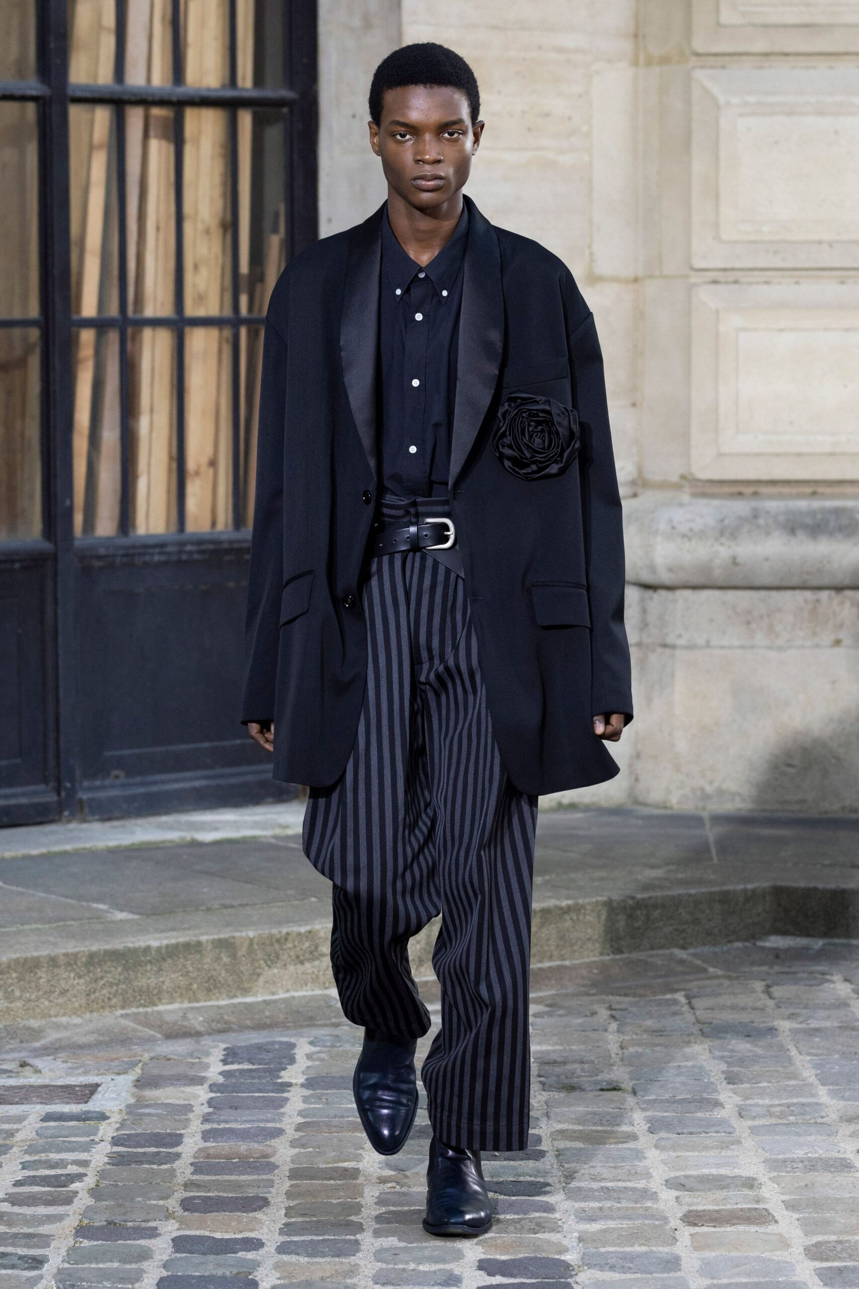 black wool long-sleeve collared oversized buttoned jacket