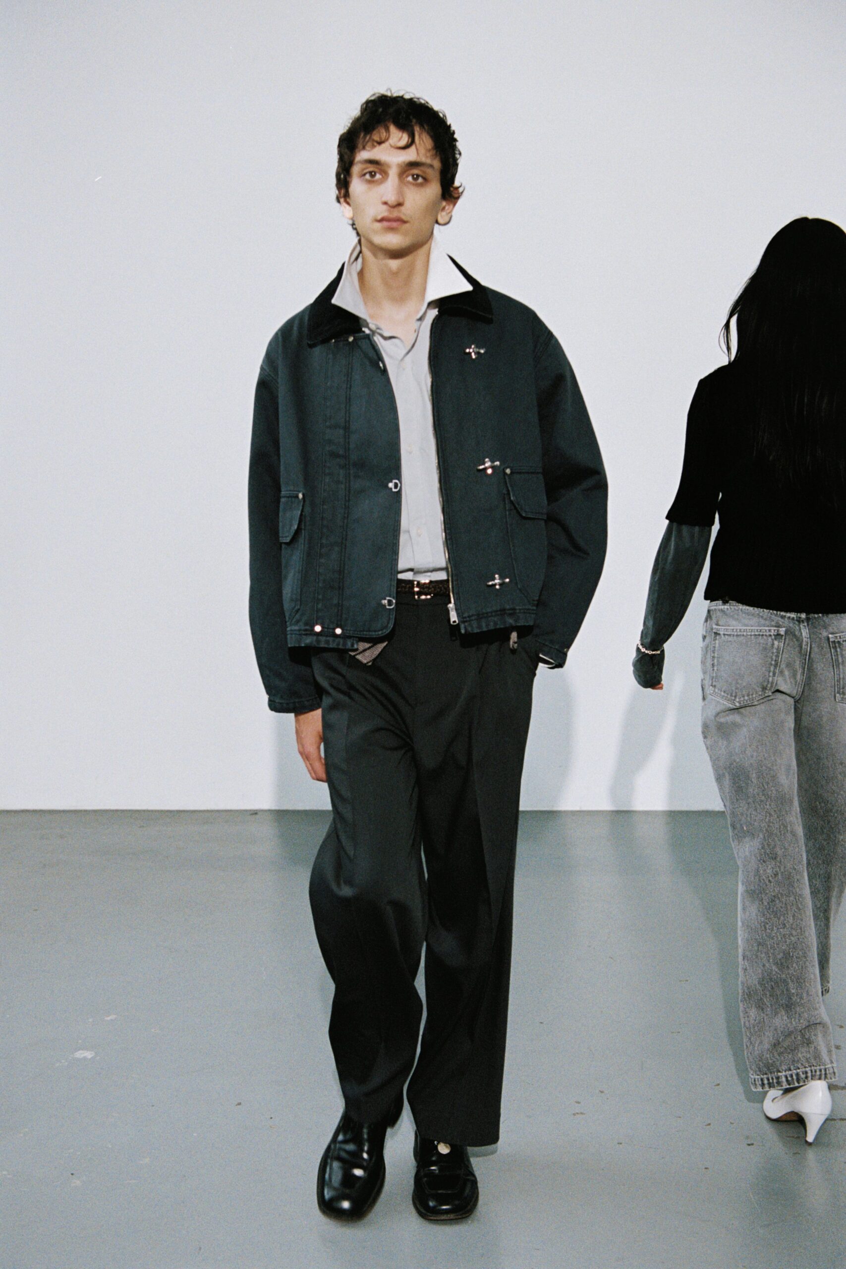 black denim jacket with gray pants