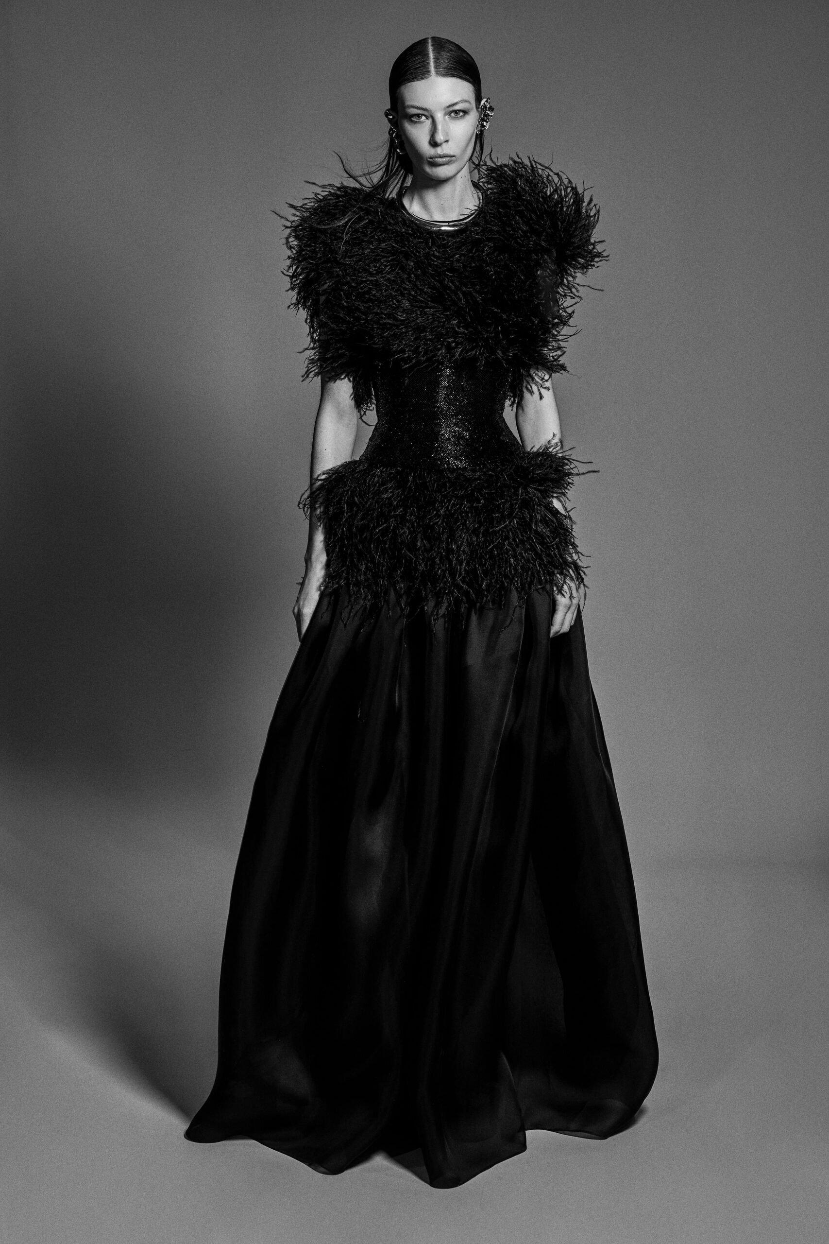 black feathered sleeveless gown