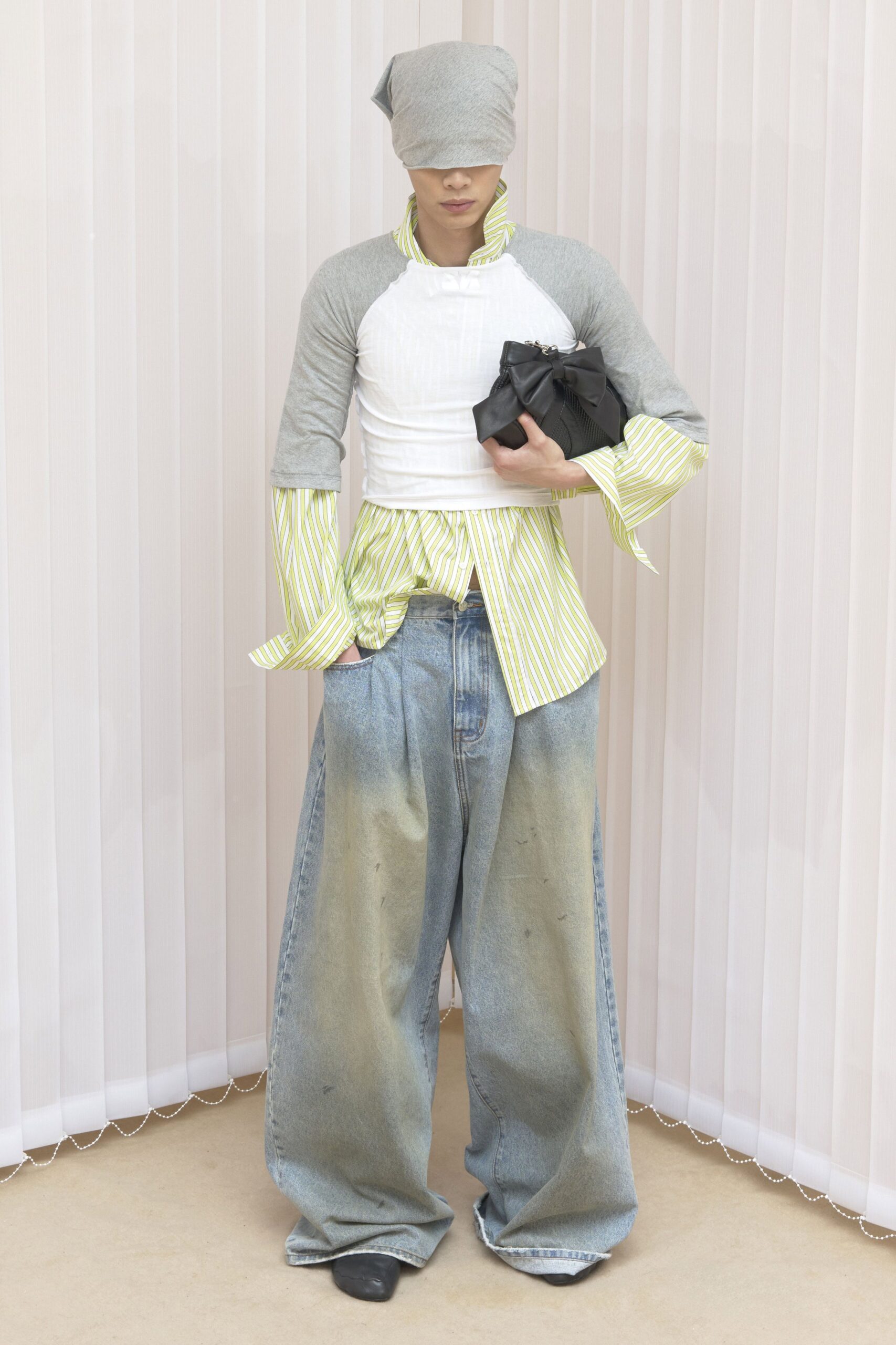relaxed gray and white top with wide-leg jeans