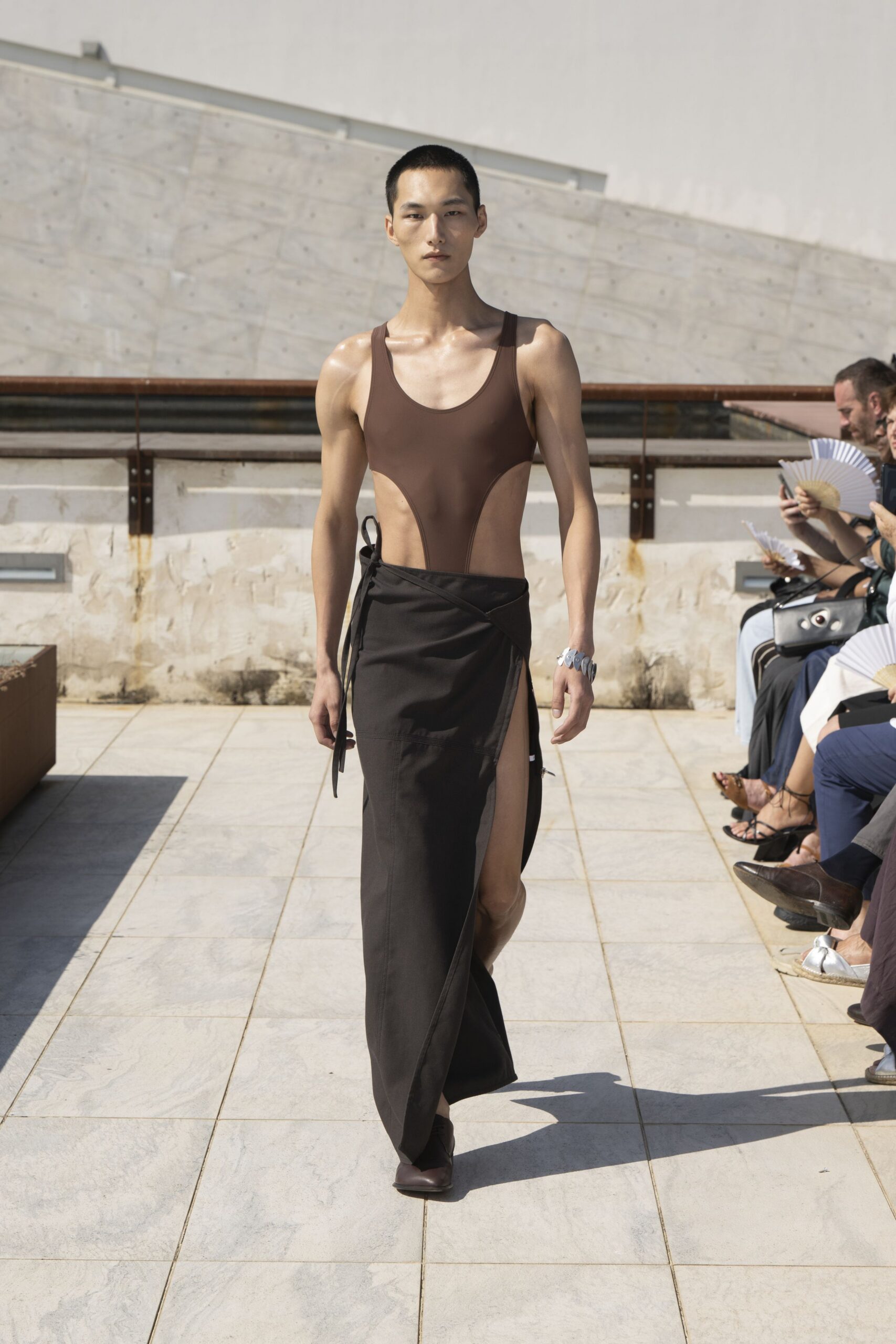 brown bodysuit black skirt