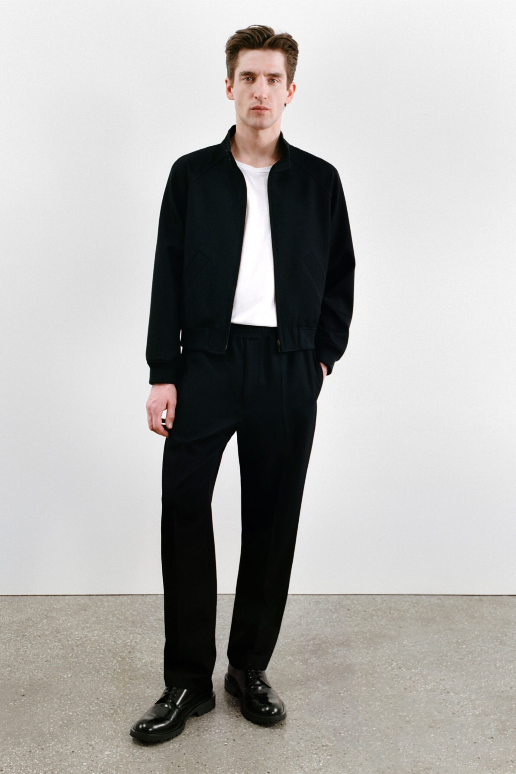 black jacket white t-shirt black pants
