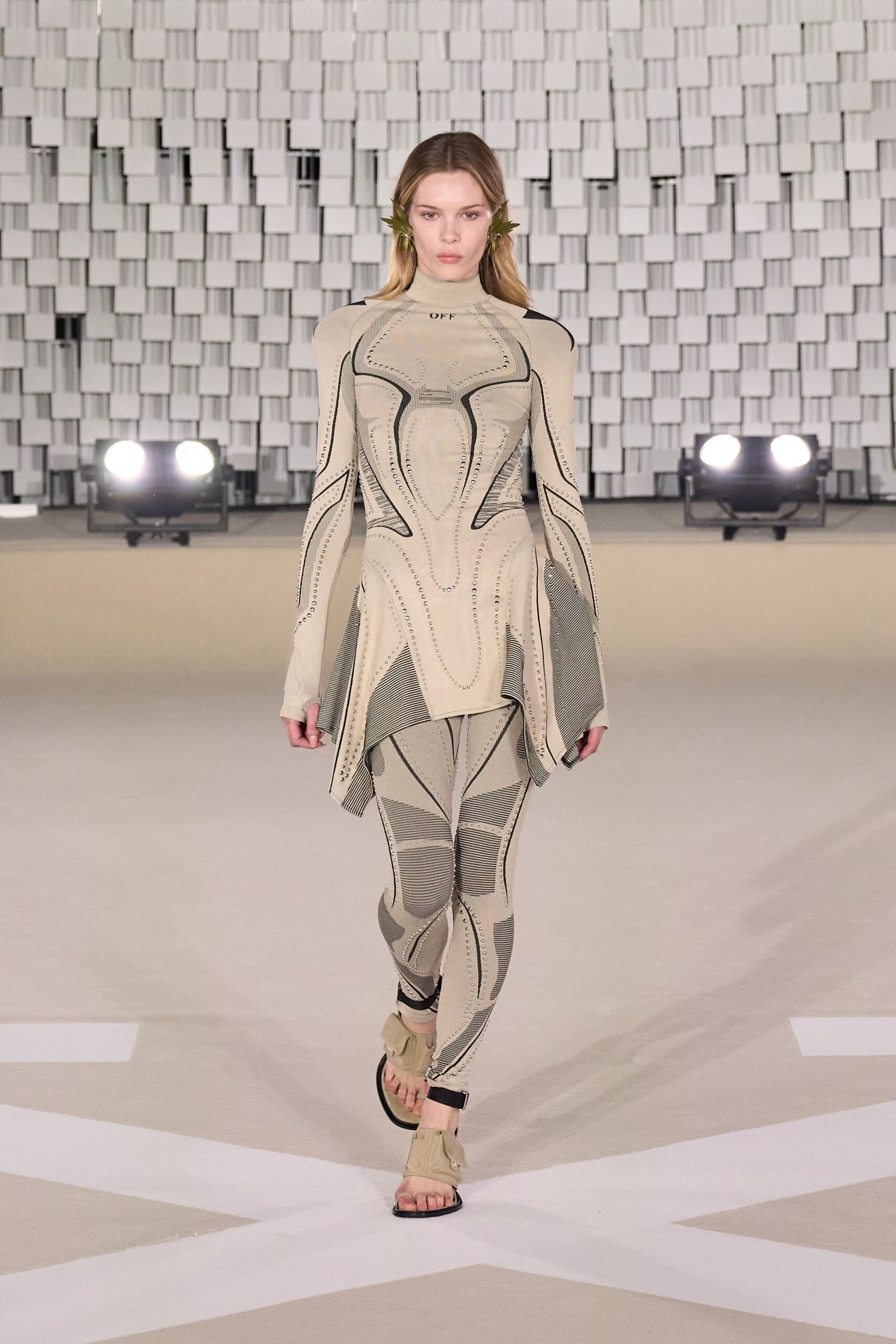 beige cotton long-sleeve high-neck fitted zippered printed catsuit