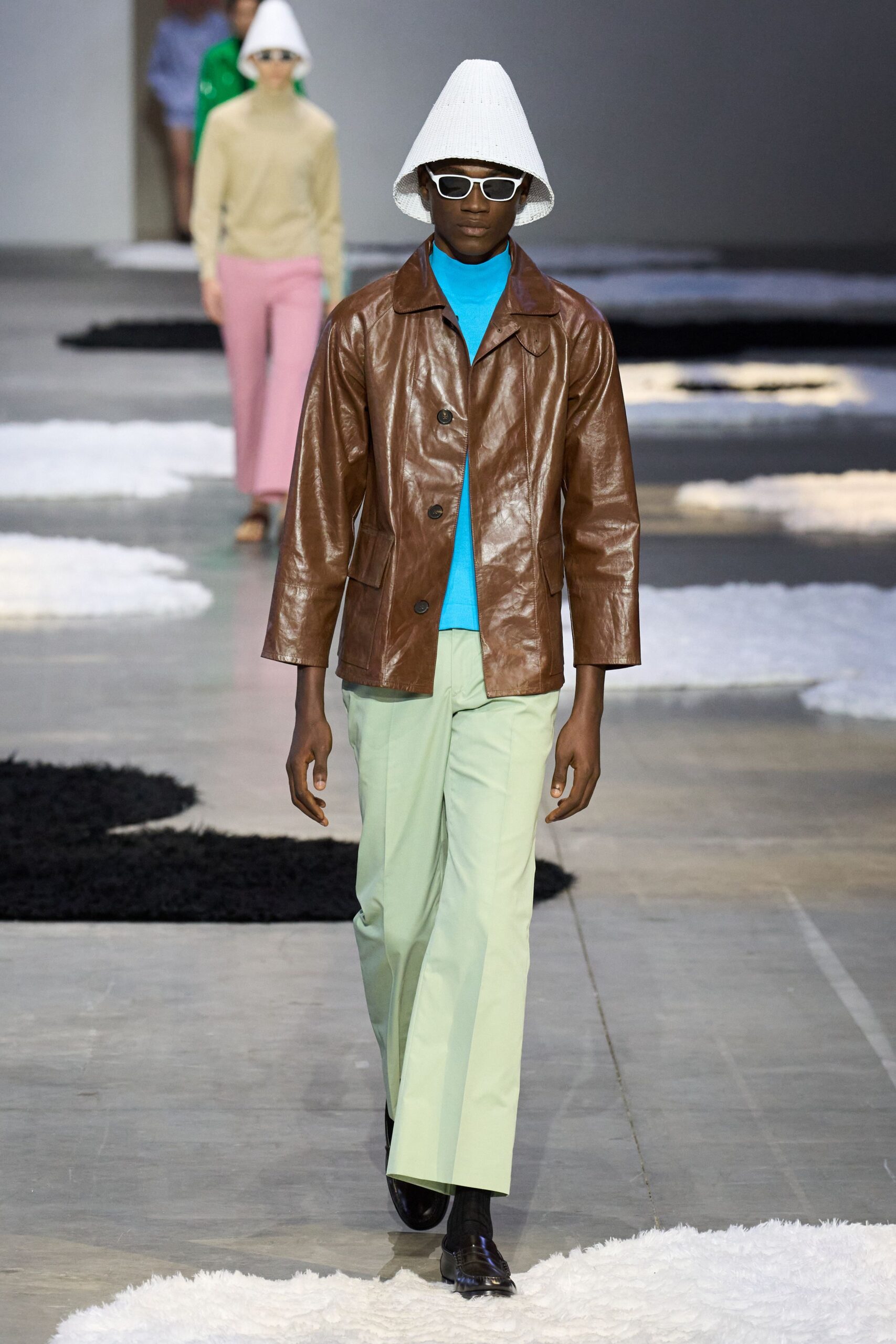 brown leather jacket with blue top