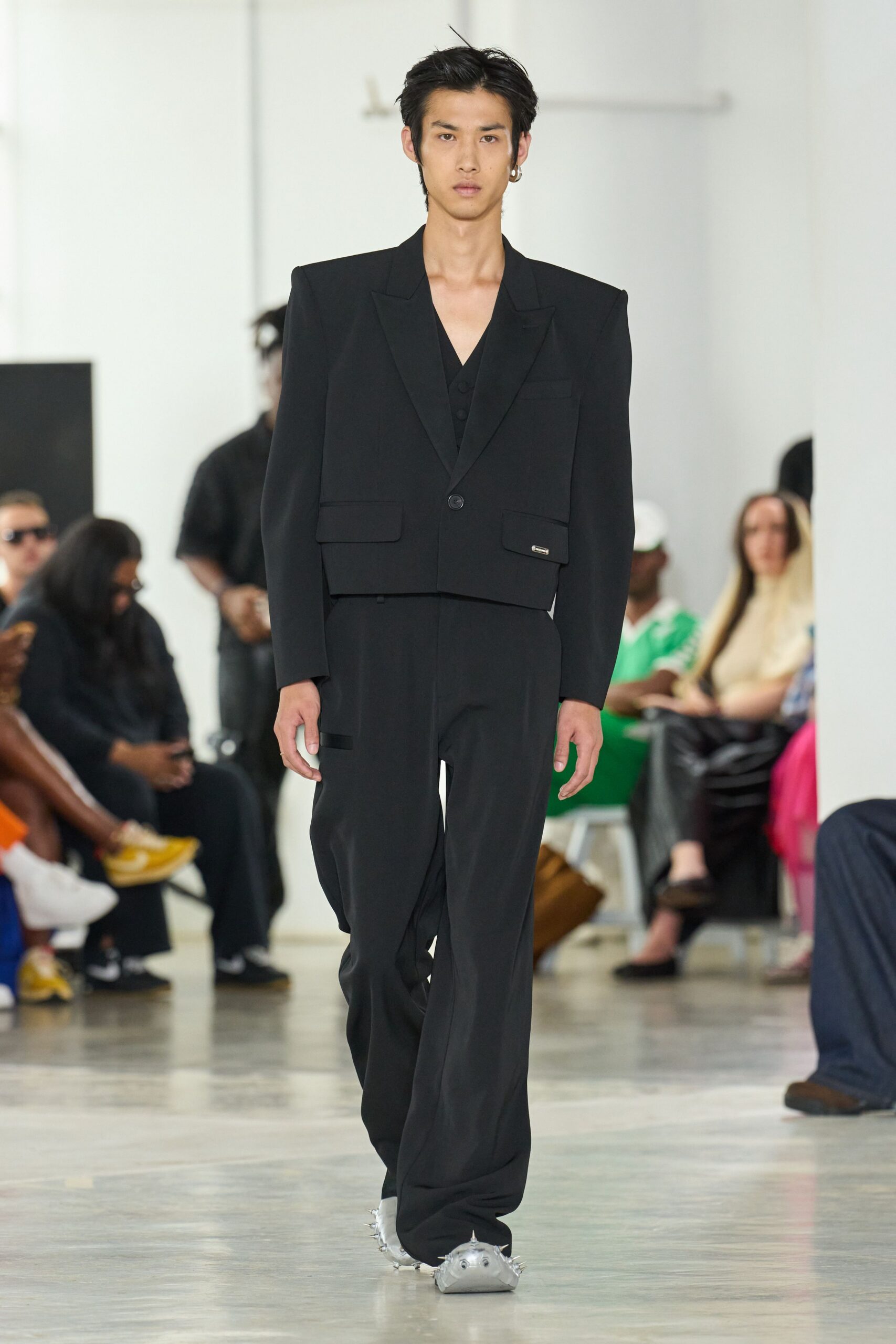 black tailored suit with gray shoes