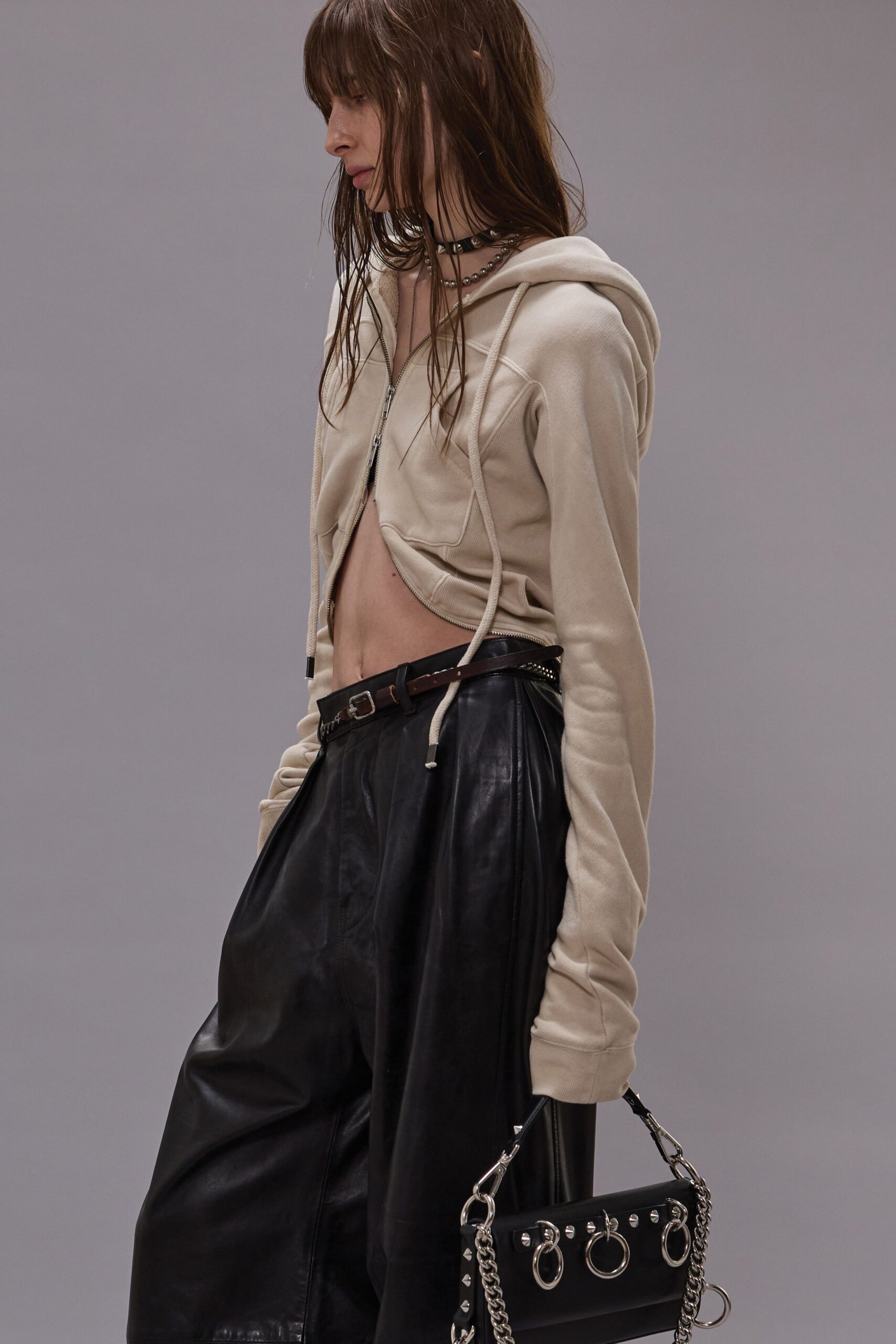 beige hoodie with black leather pants
