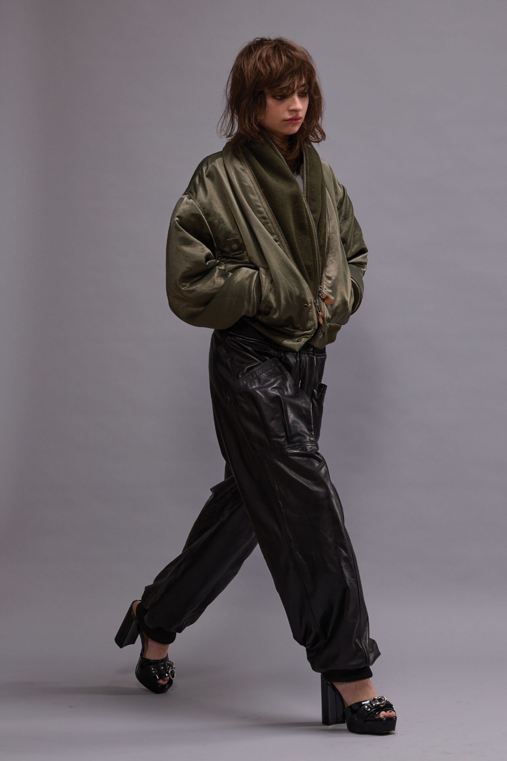 green relaxed jacket black leather pants