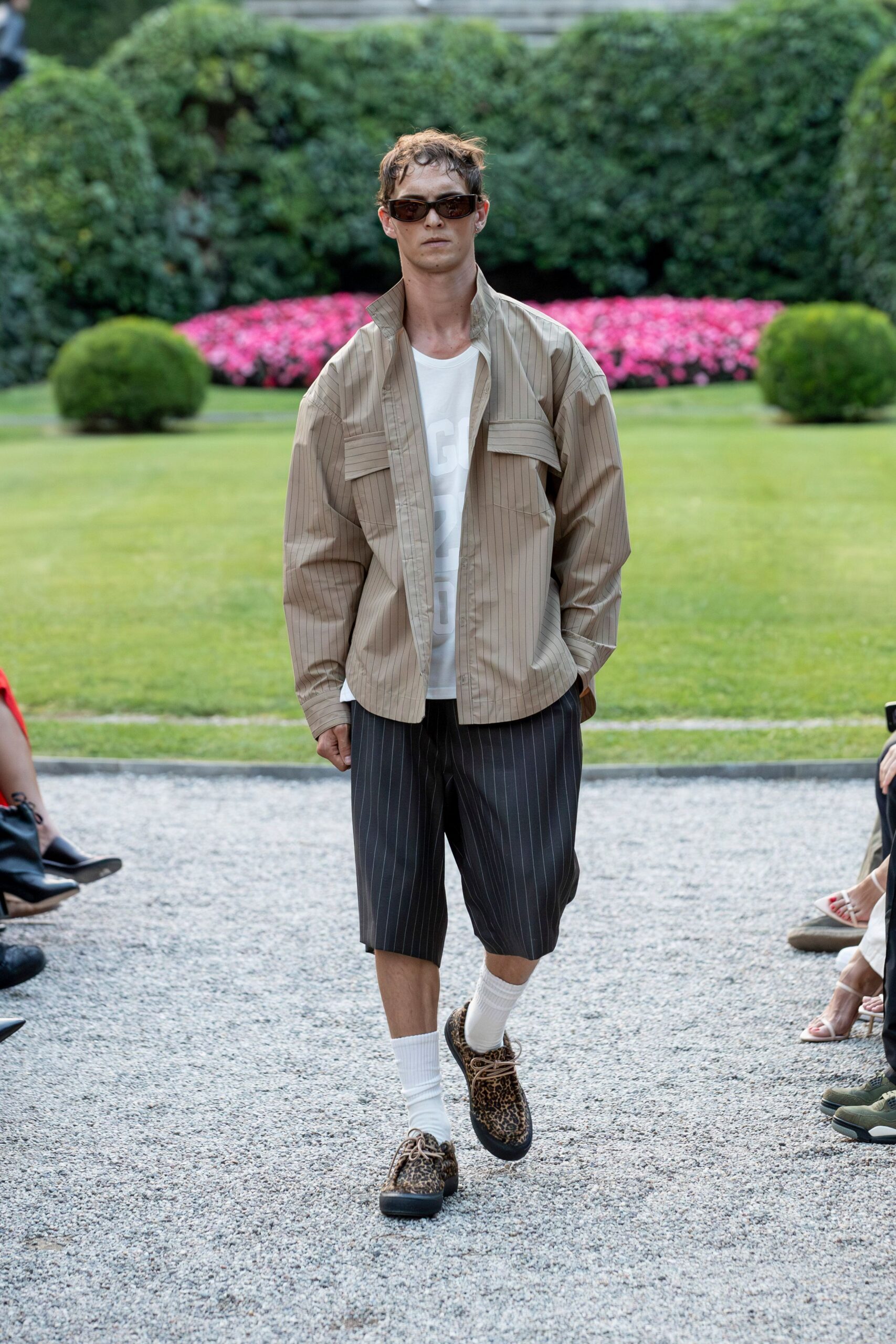 beige relaxed jacket with black shorts