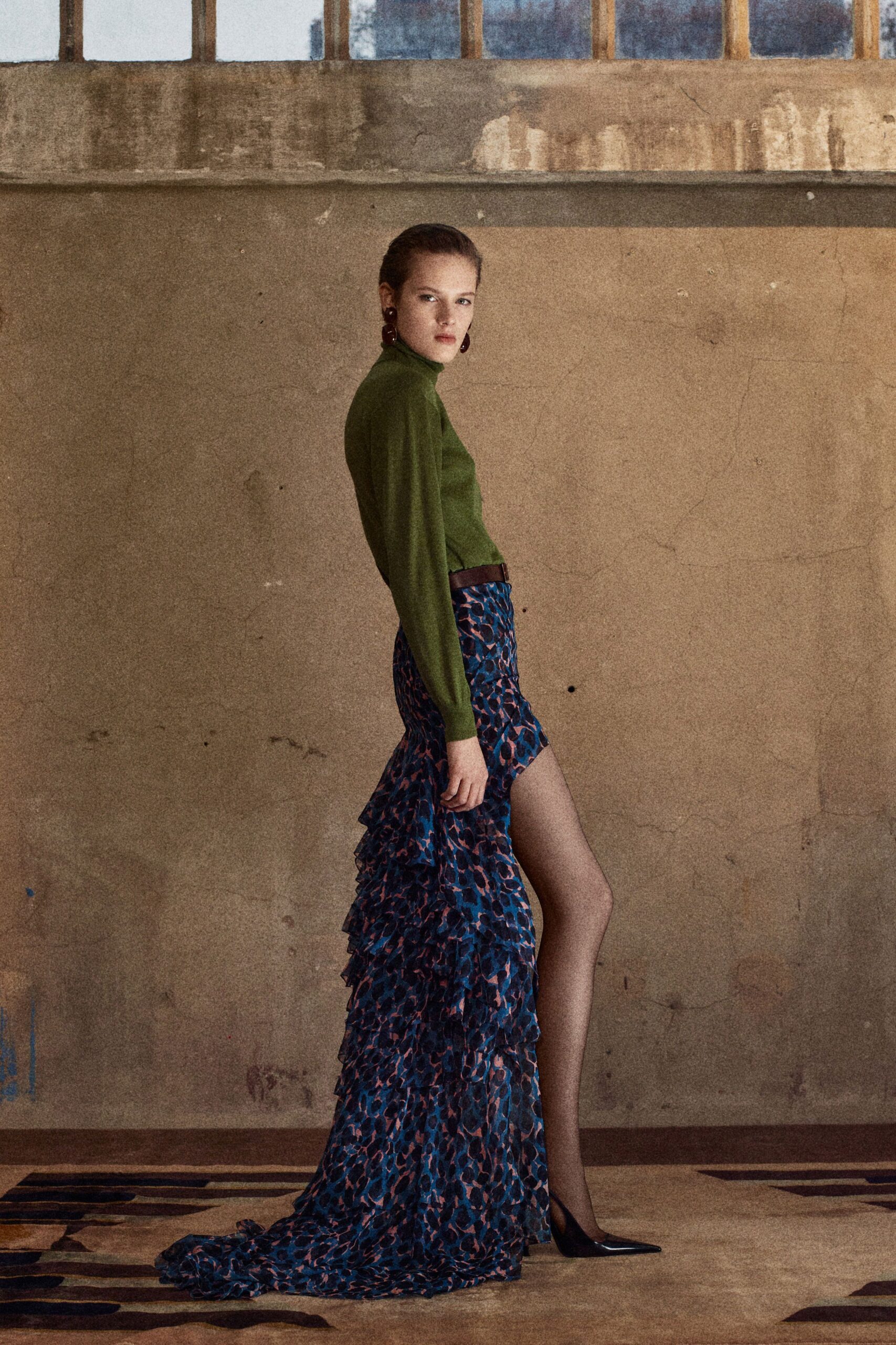 green fitted top with blue ruffled skirt