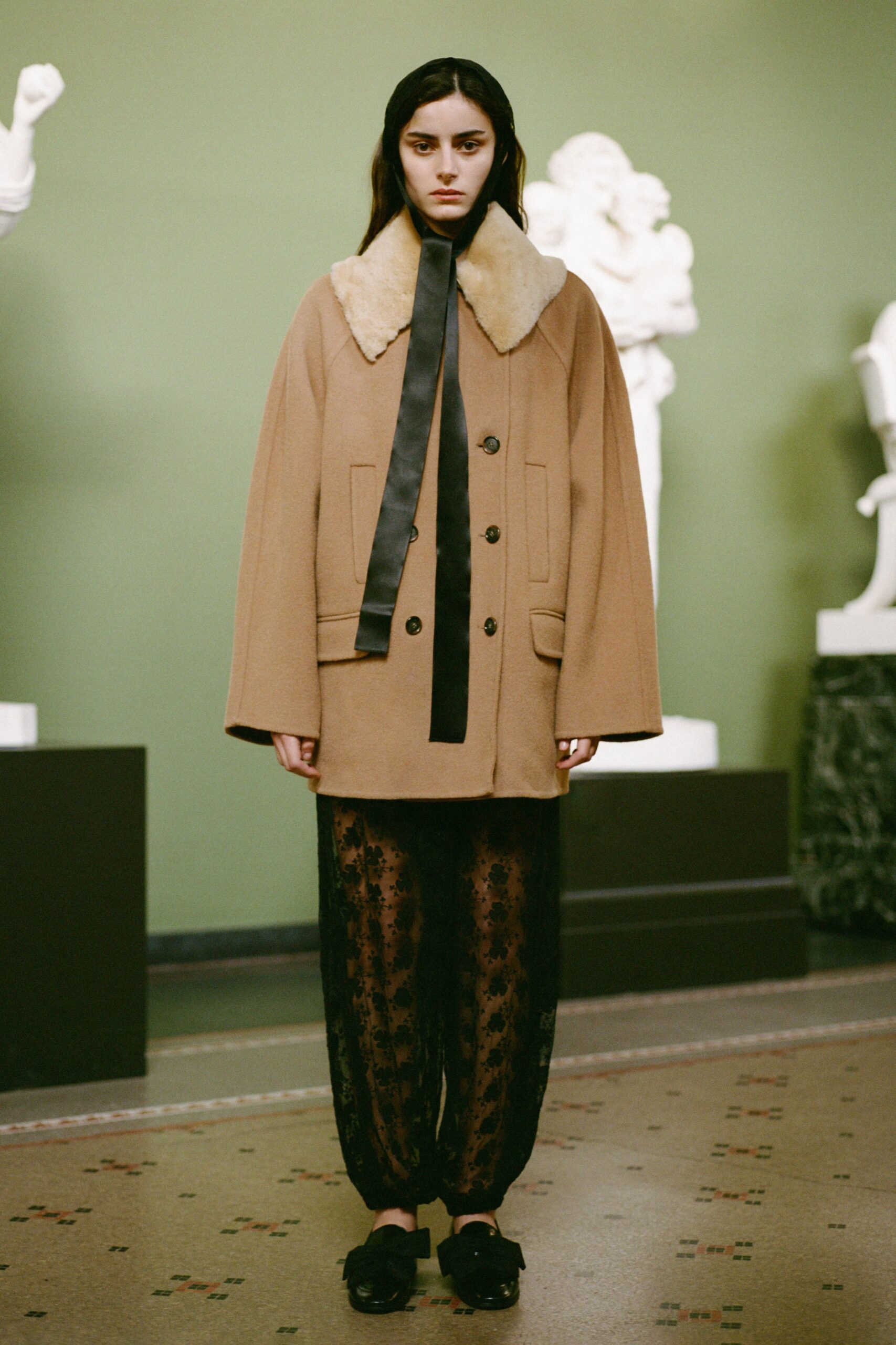 beige wool coat black silk pants