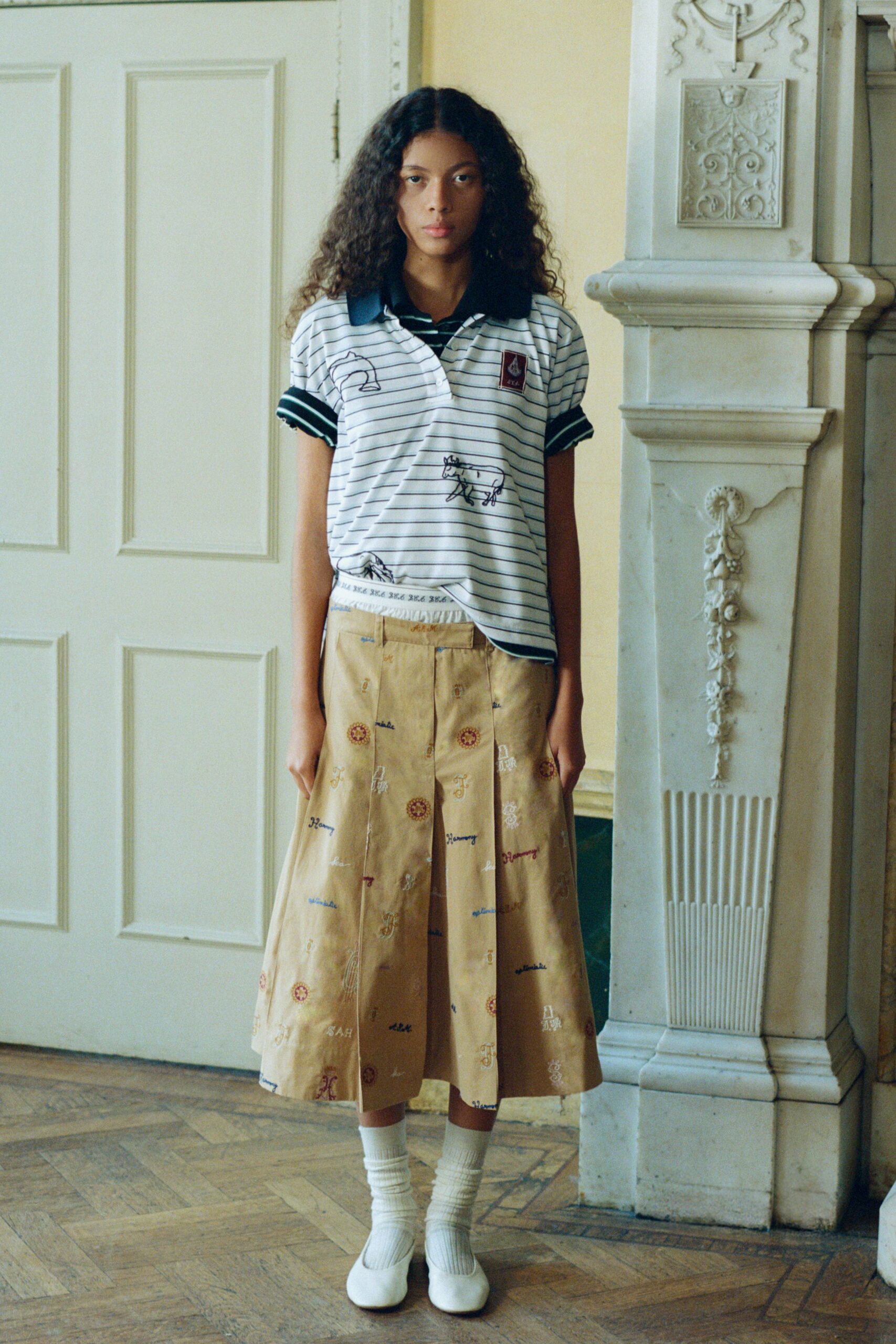 white striped shirt beige pleated skirt