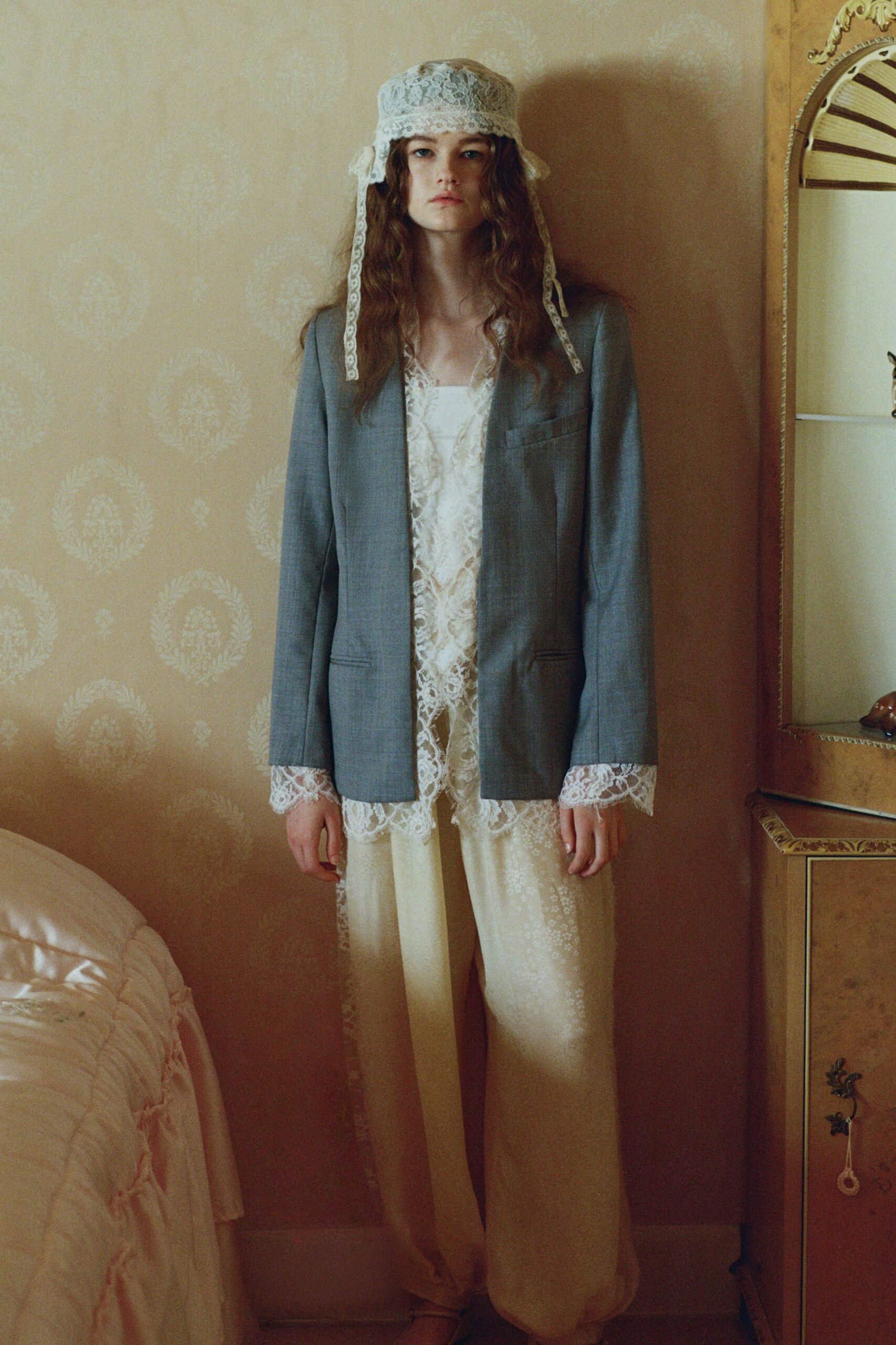 blue blazer white lace top beige pants