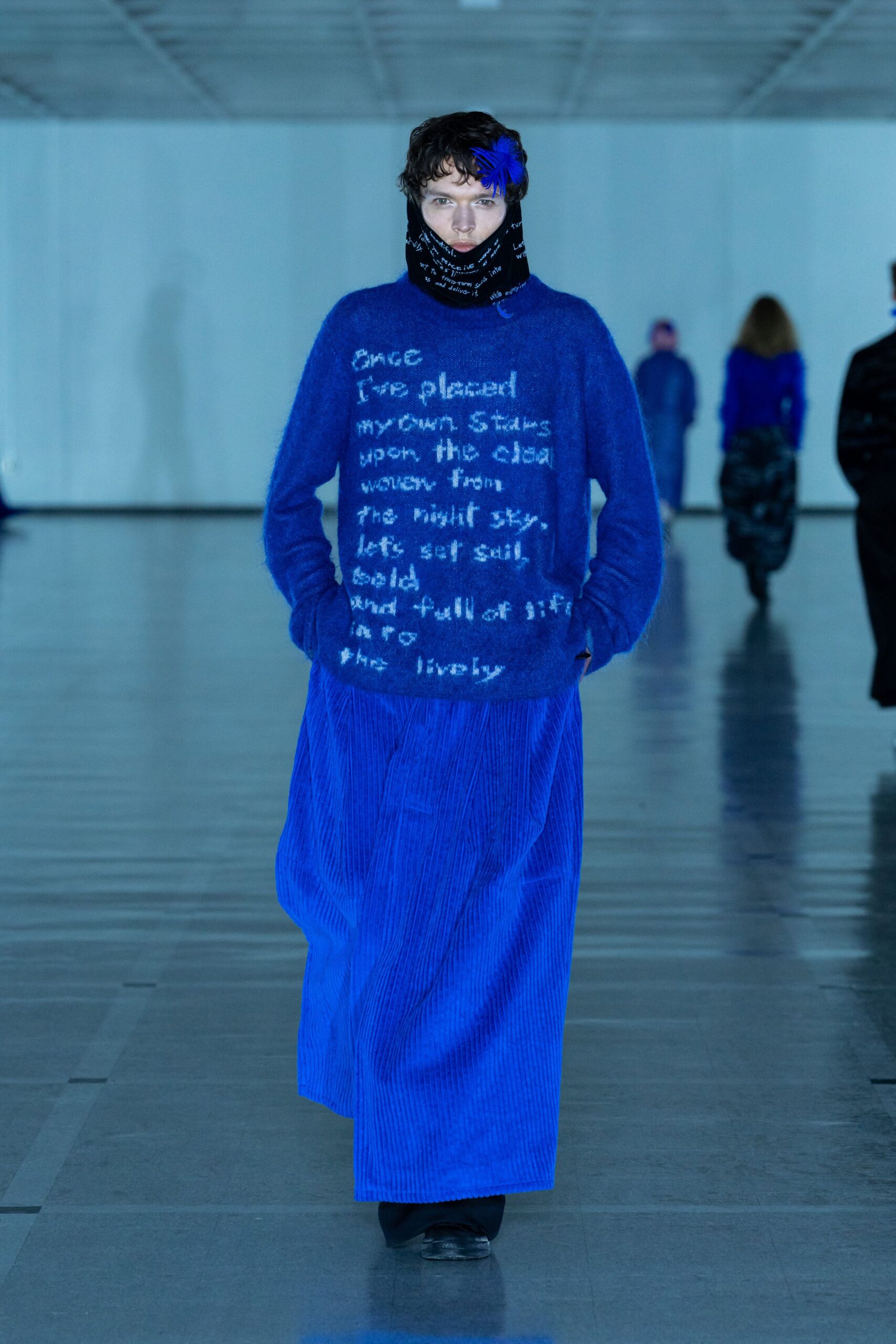 blue relaxed sweater with pleated skirt