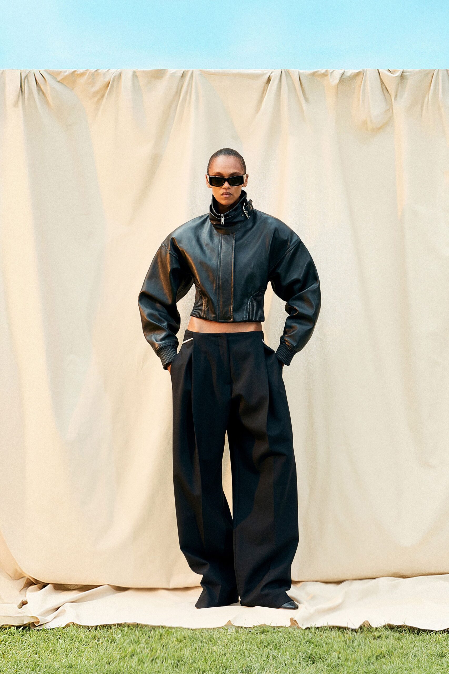 black leather jacket and relaxed pants