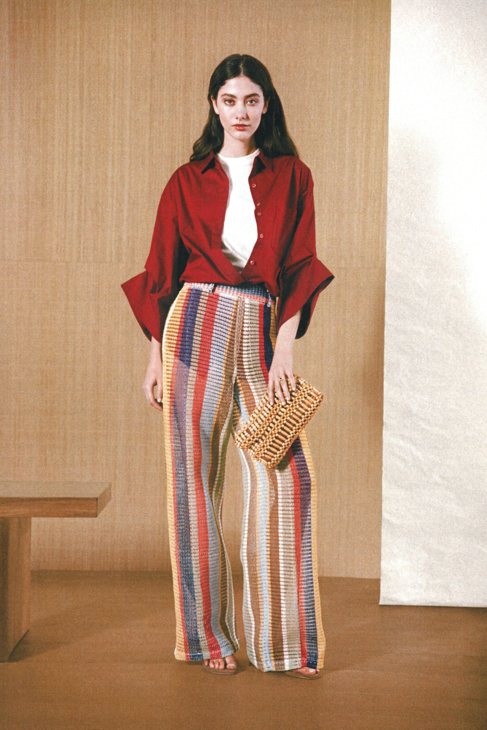 red shirt multi-striped pants