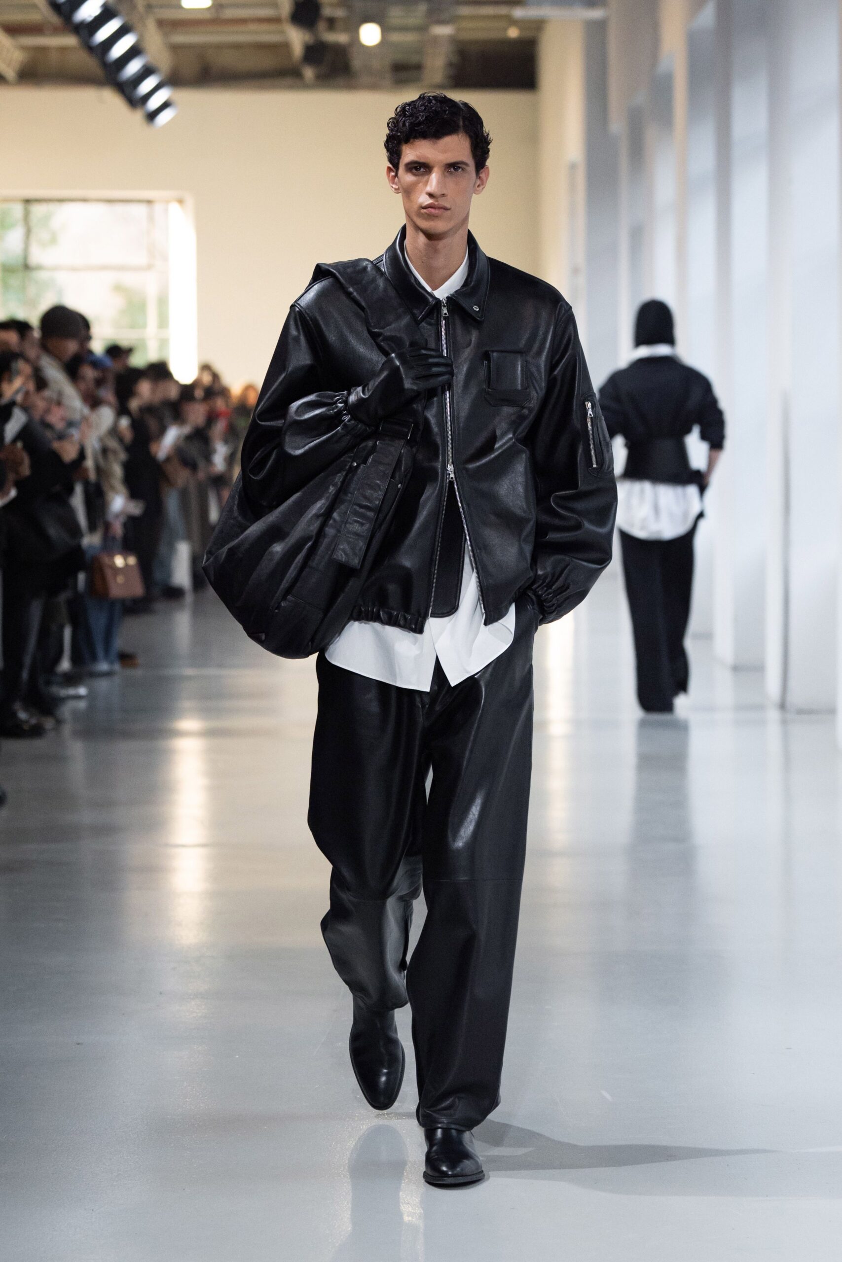 black leather long-sleeve collared oversized zippered pockets jacket