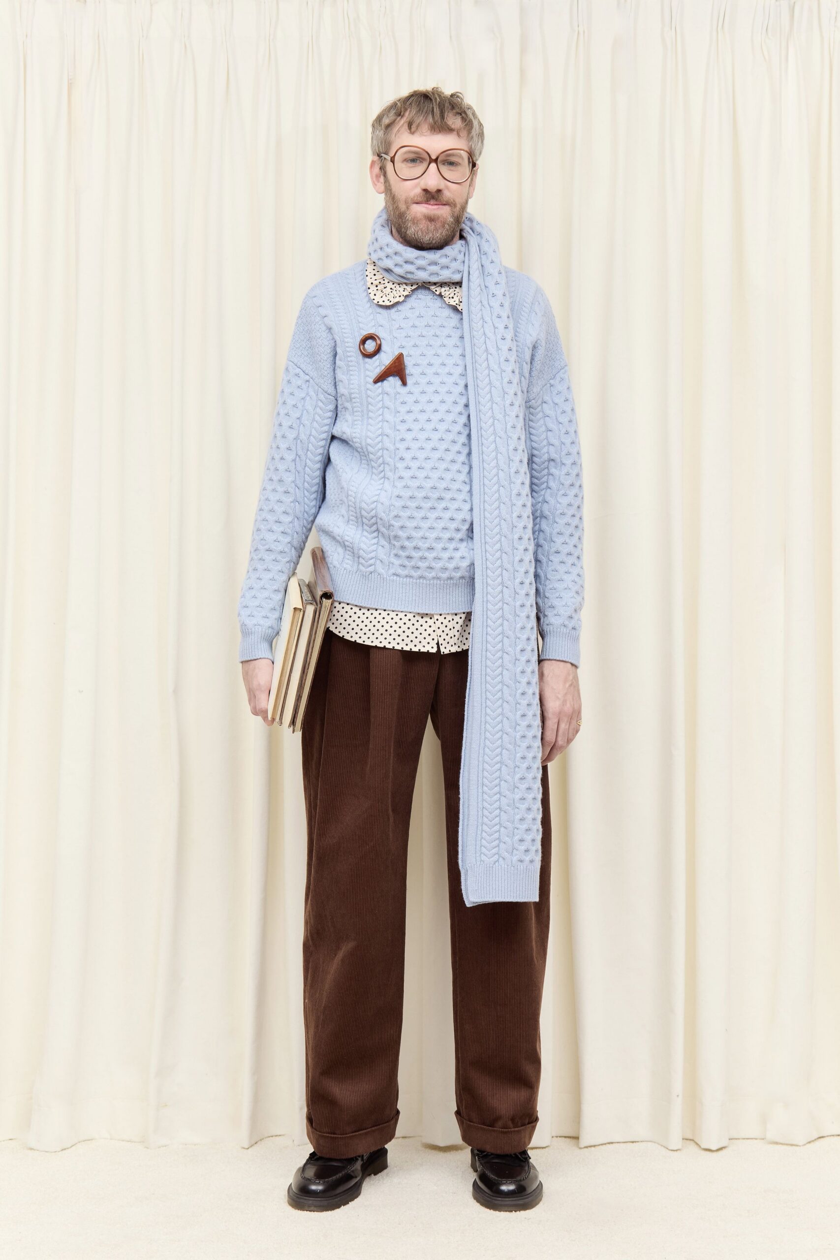 blue relaxed sweater with brown pants