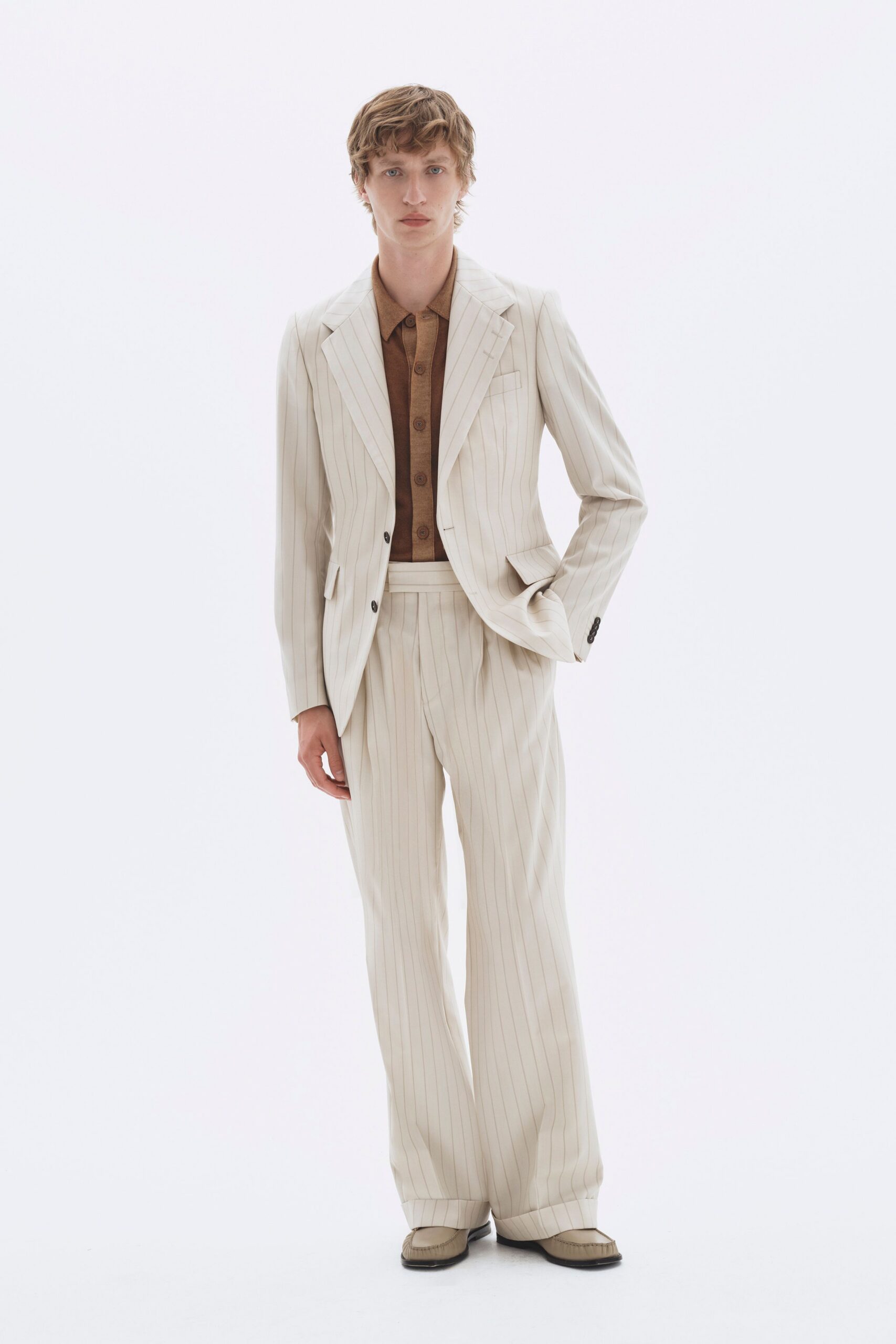 beige tailored suit with brown shirt