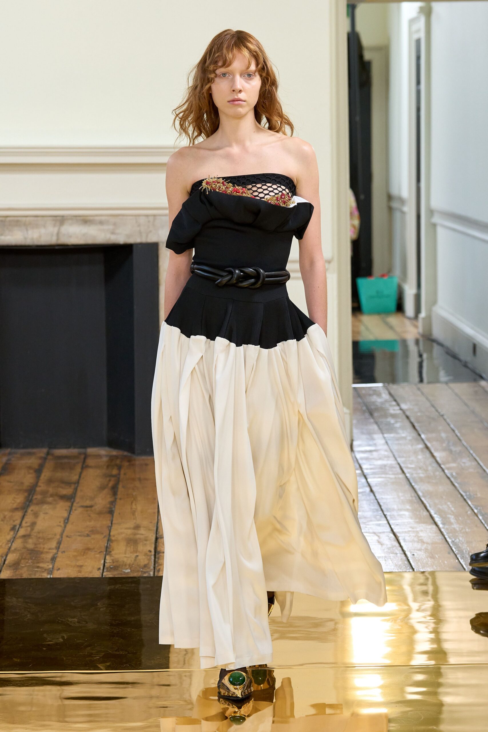 black silk strapless fitted ruffled layered flowing gown