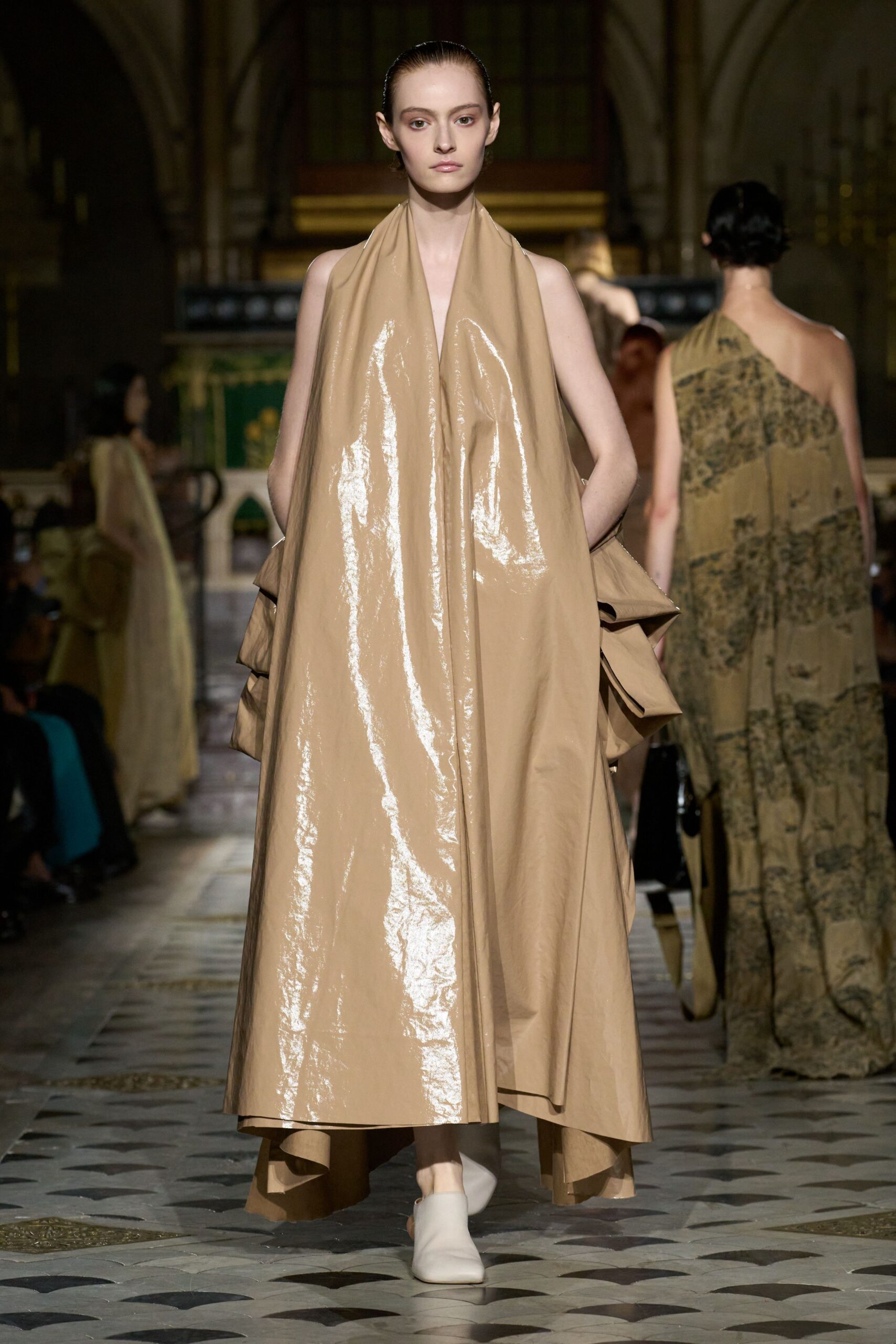 beige vinyl sleeveless high-neck relaxed draped shiny dress