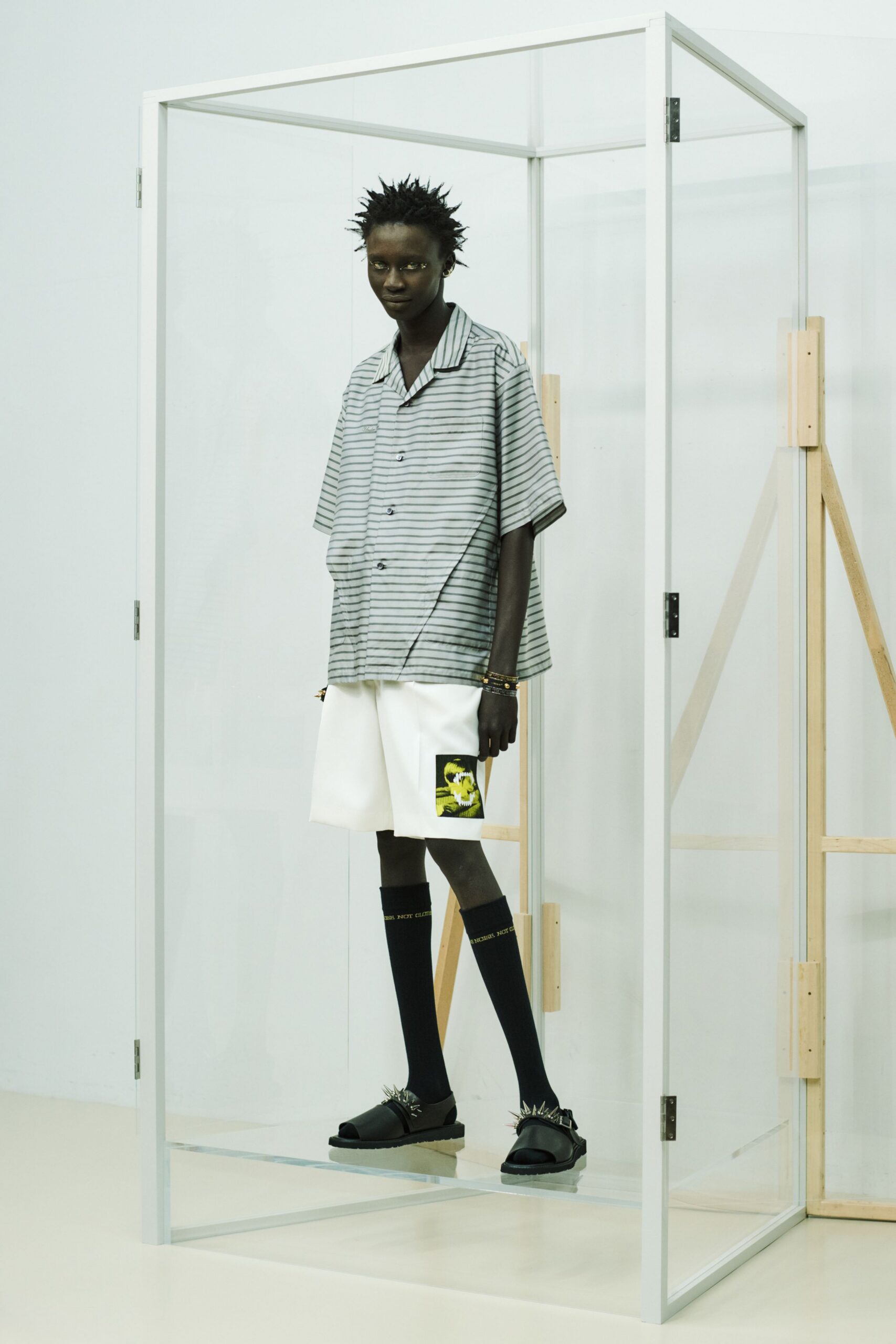 gray striped shirt with white shorts