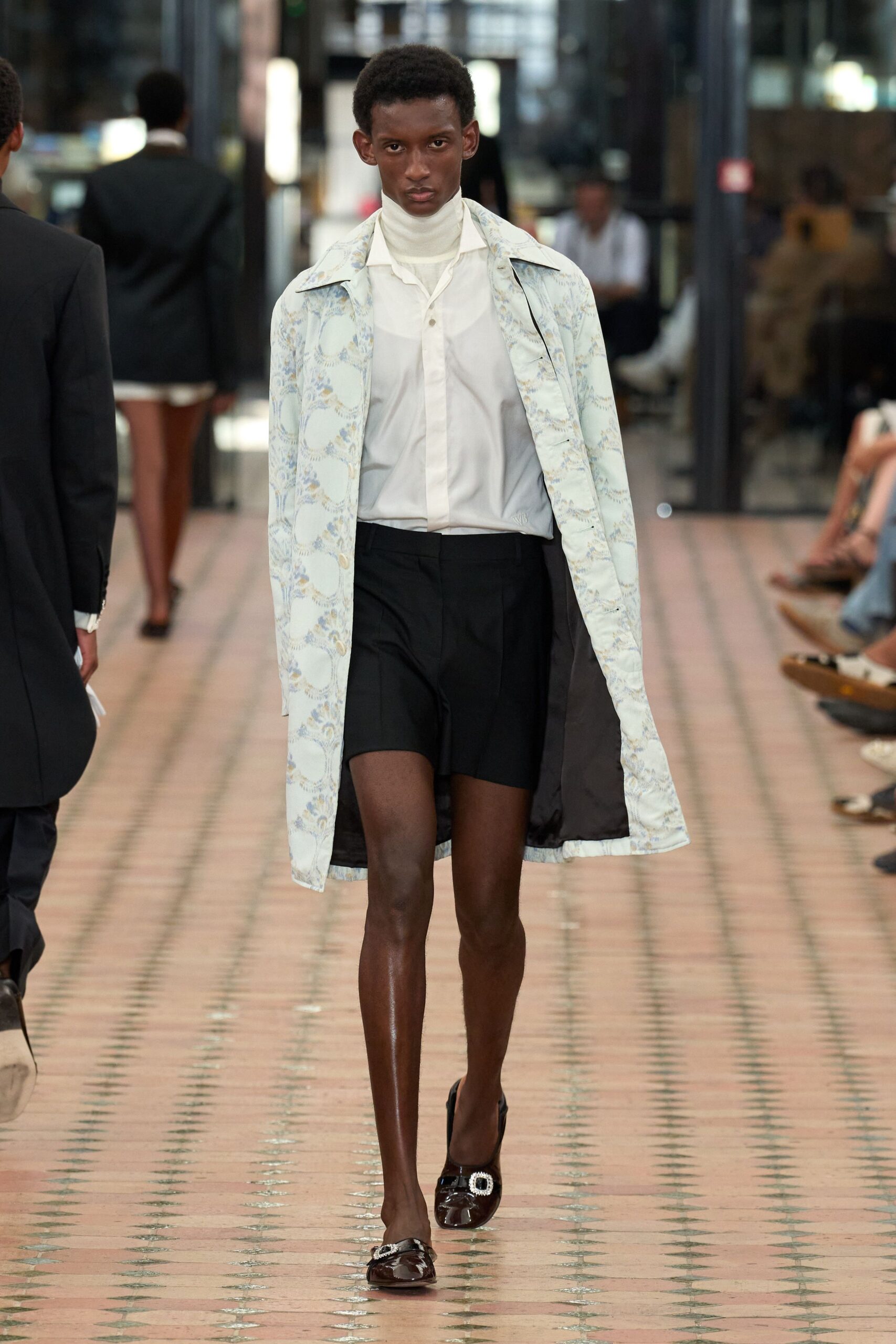 light blue coat with black shorts