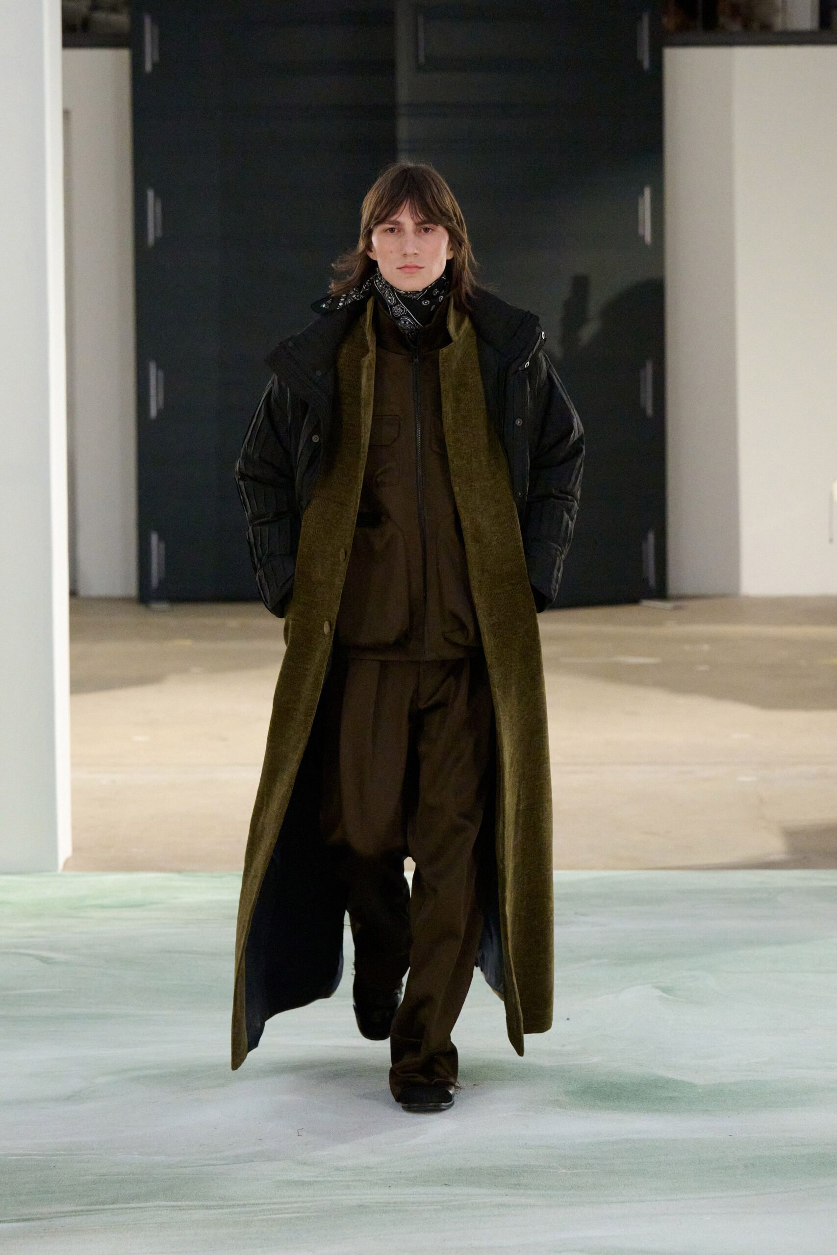 black coat and jacket with brown pants