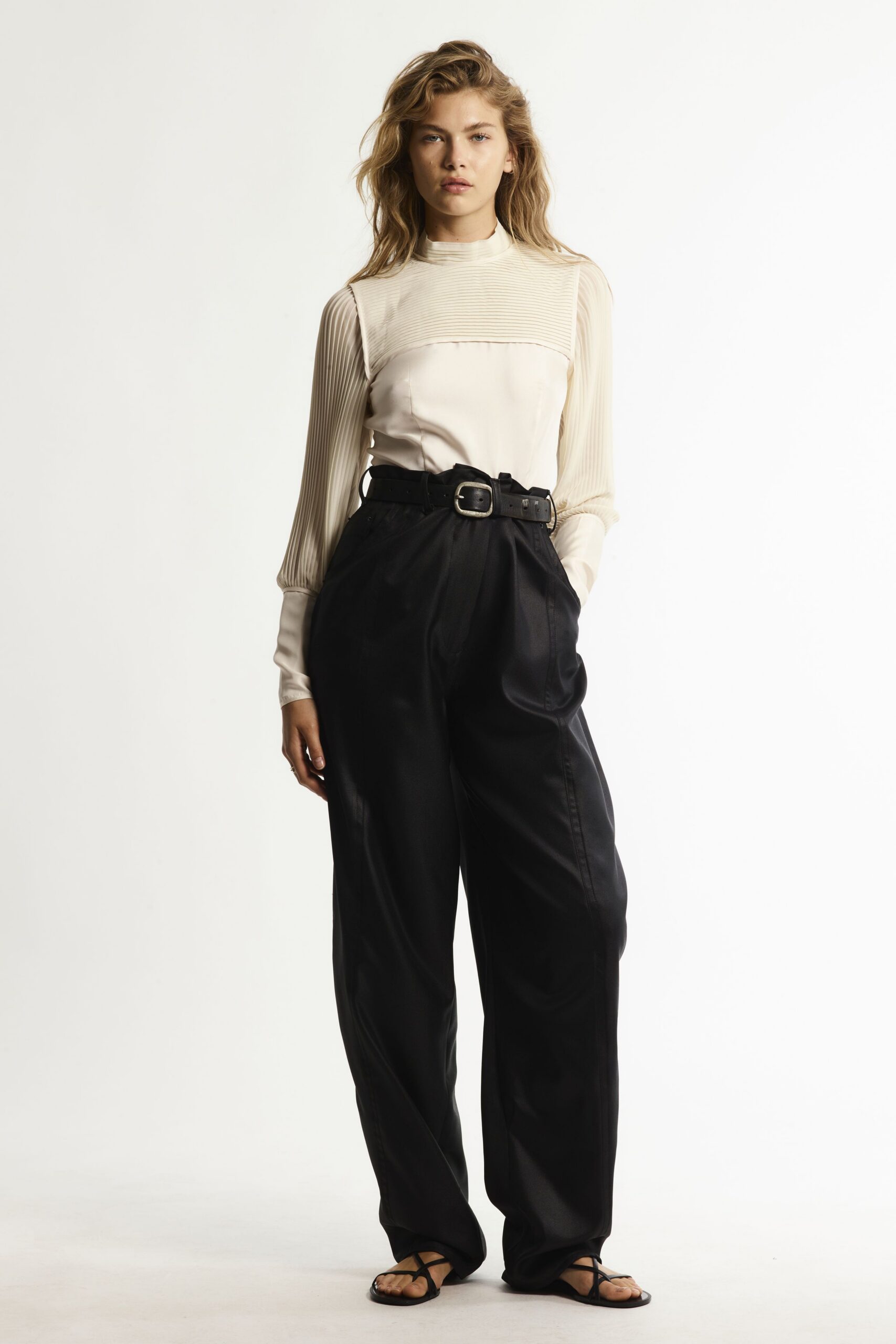 white fitted top with black pants