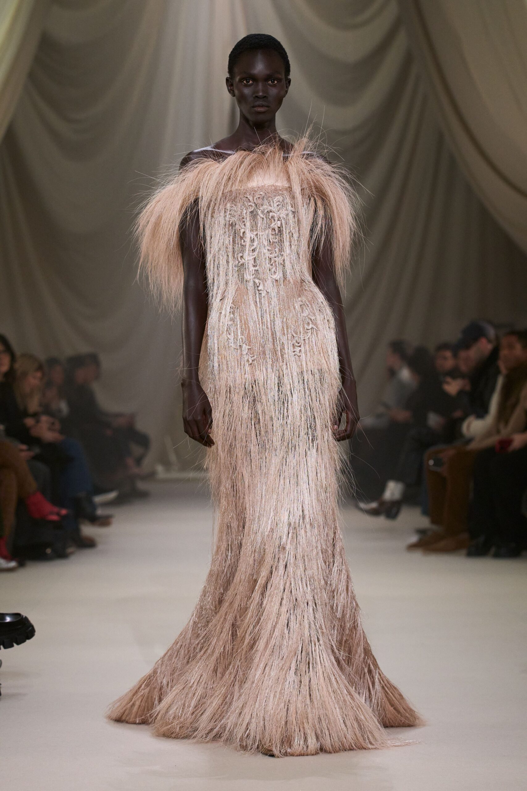 beige fringed off-shoulder gown
