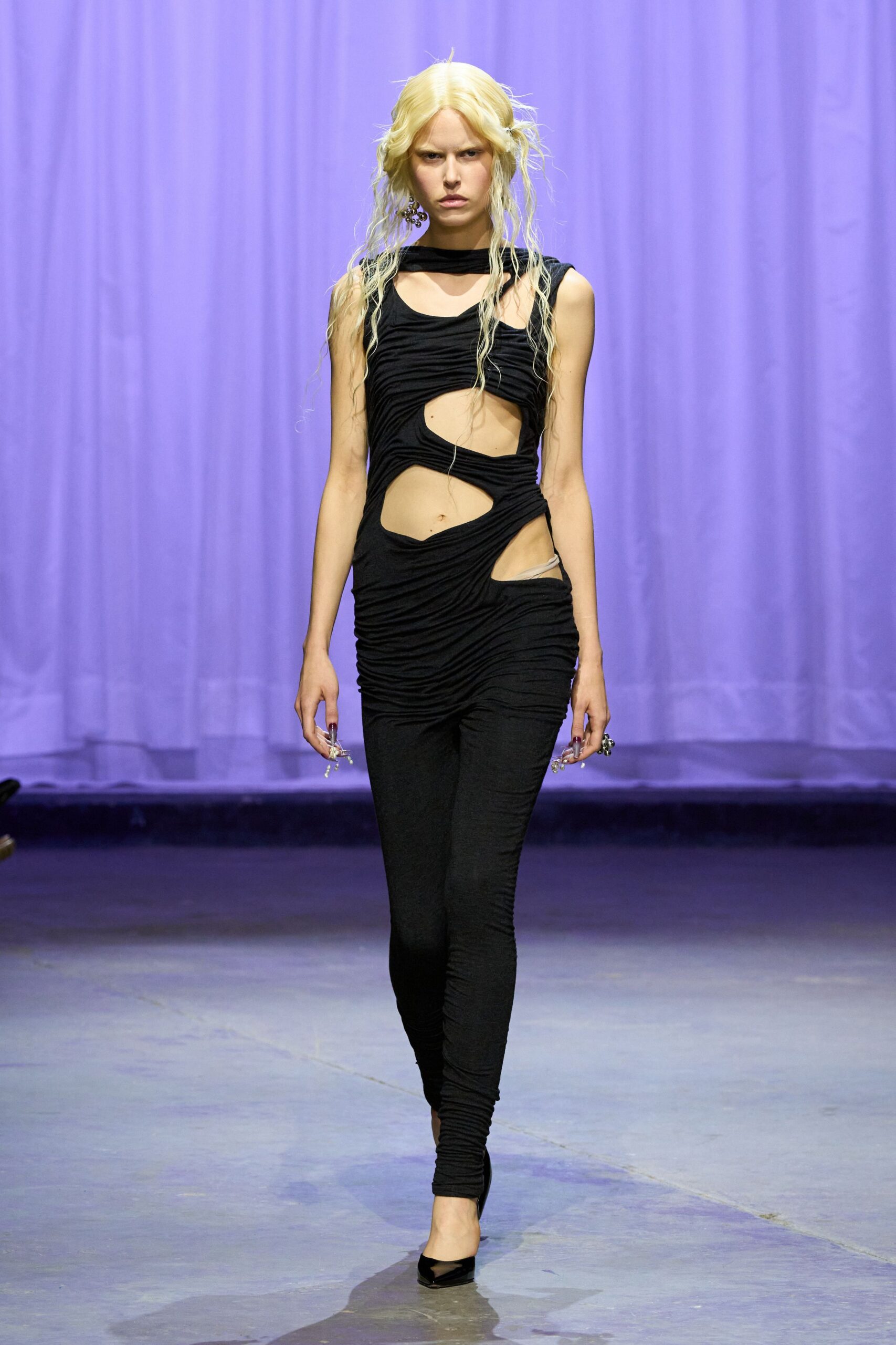 black fitted catsuit with cutouts