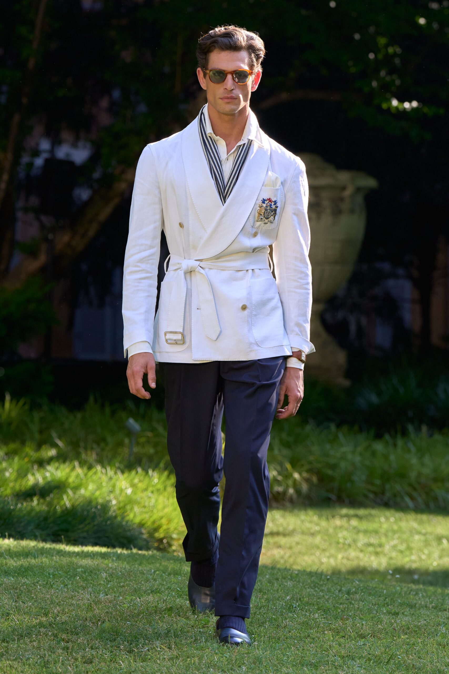 white tailored blazer with navy pants